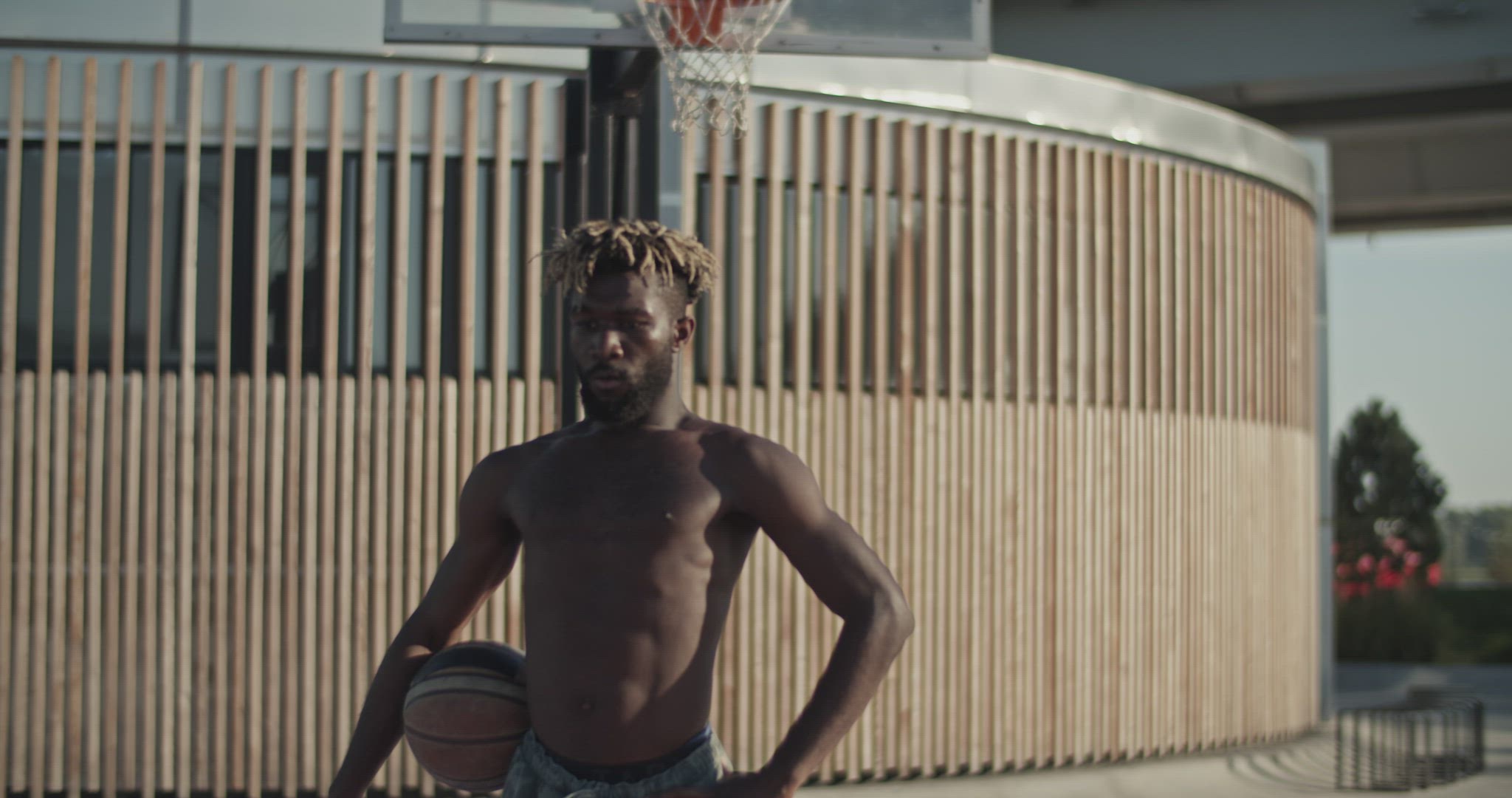 Tired black basketball player taking break