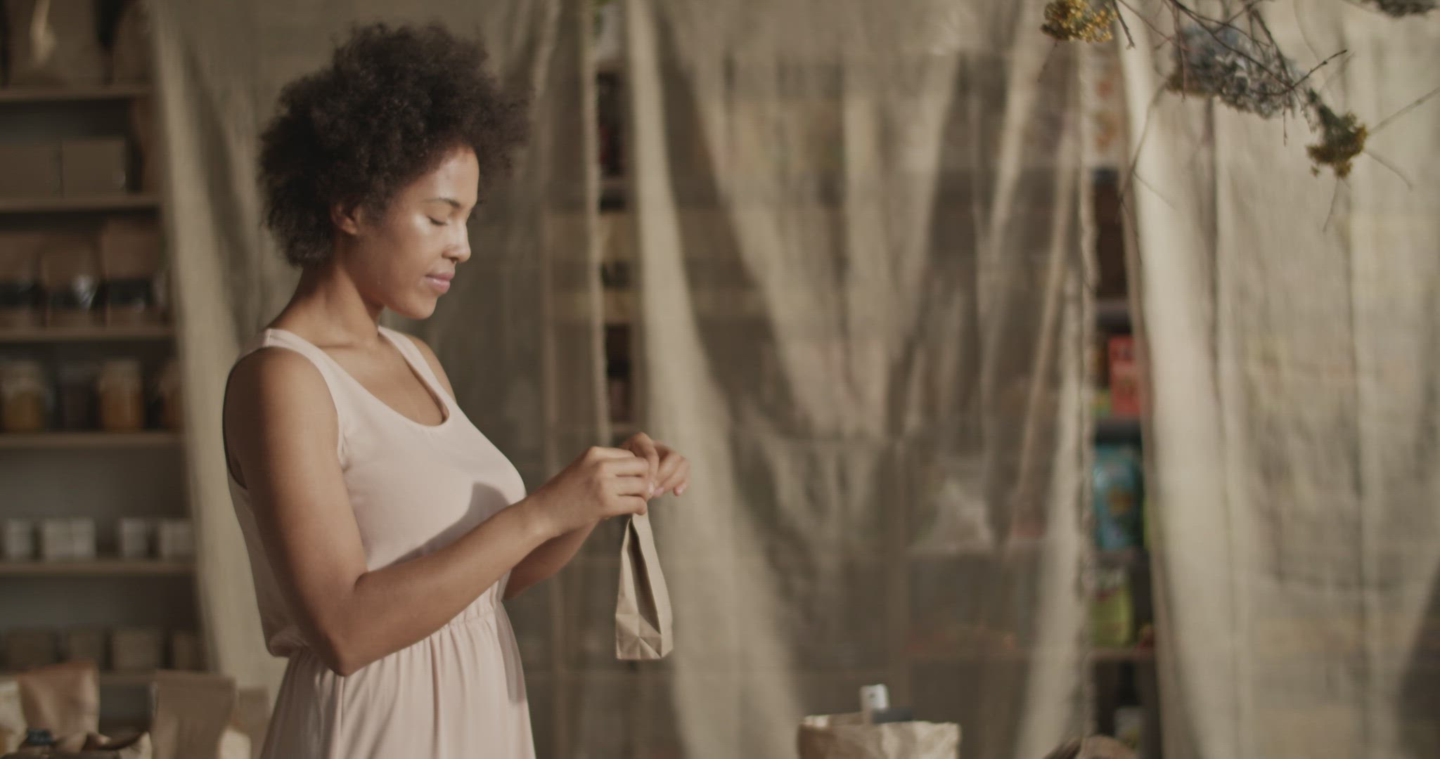 Content woman packing eco product for order