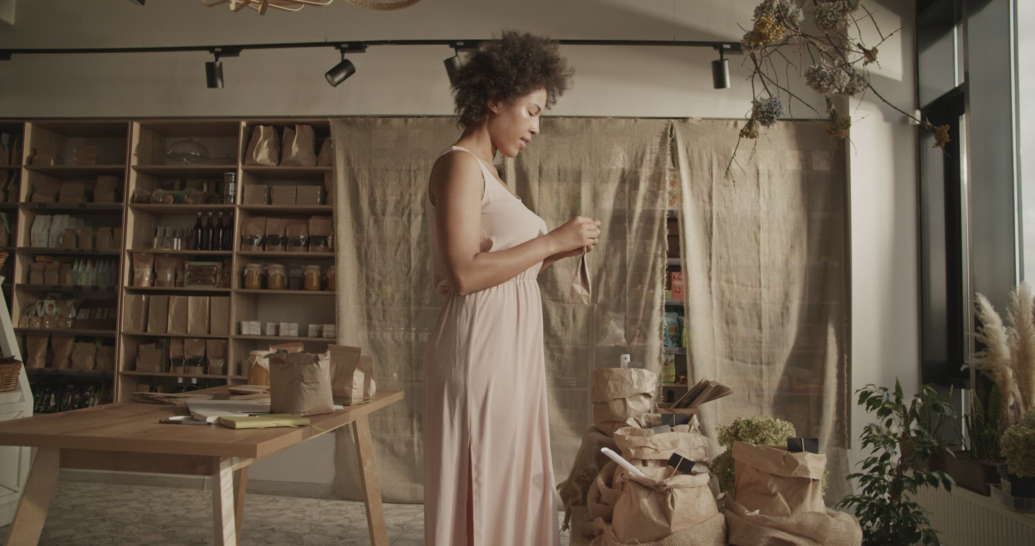 Content woman packing eco product for order