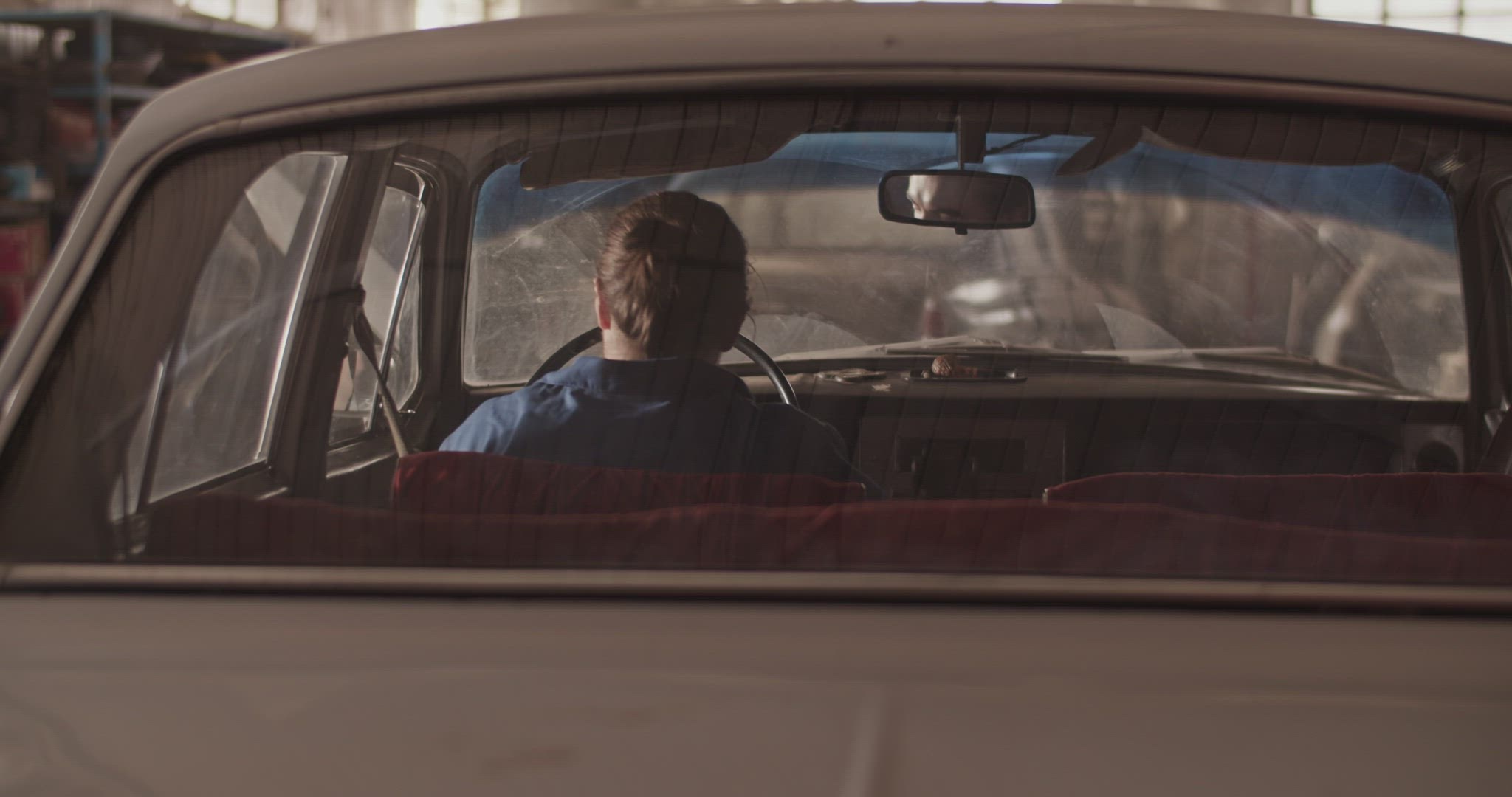 Anonymous technician testing vintage car
