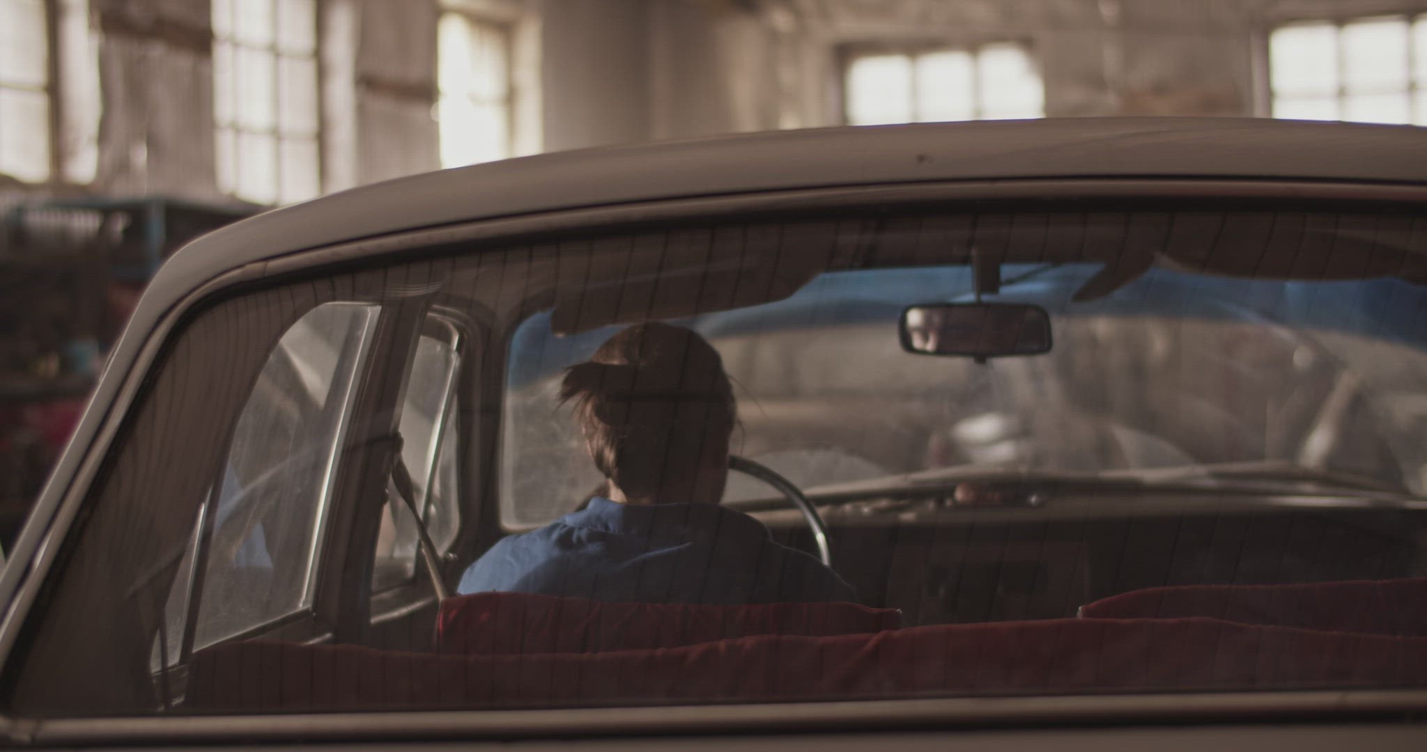 Anonymous technician testing vintage car