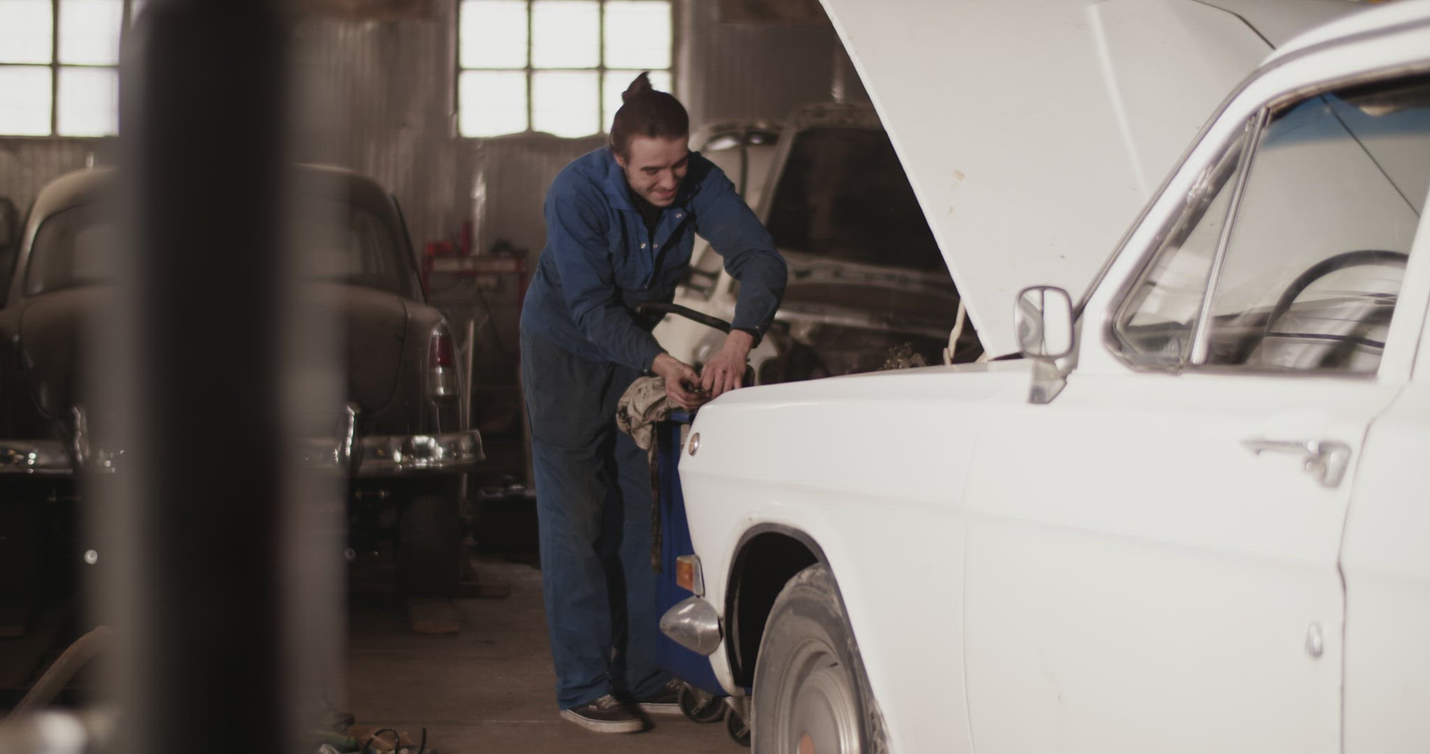 Man preparing to install cylinder head cover