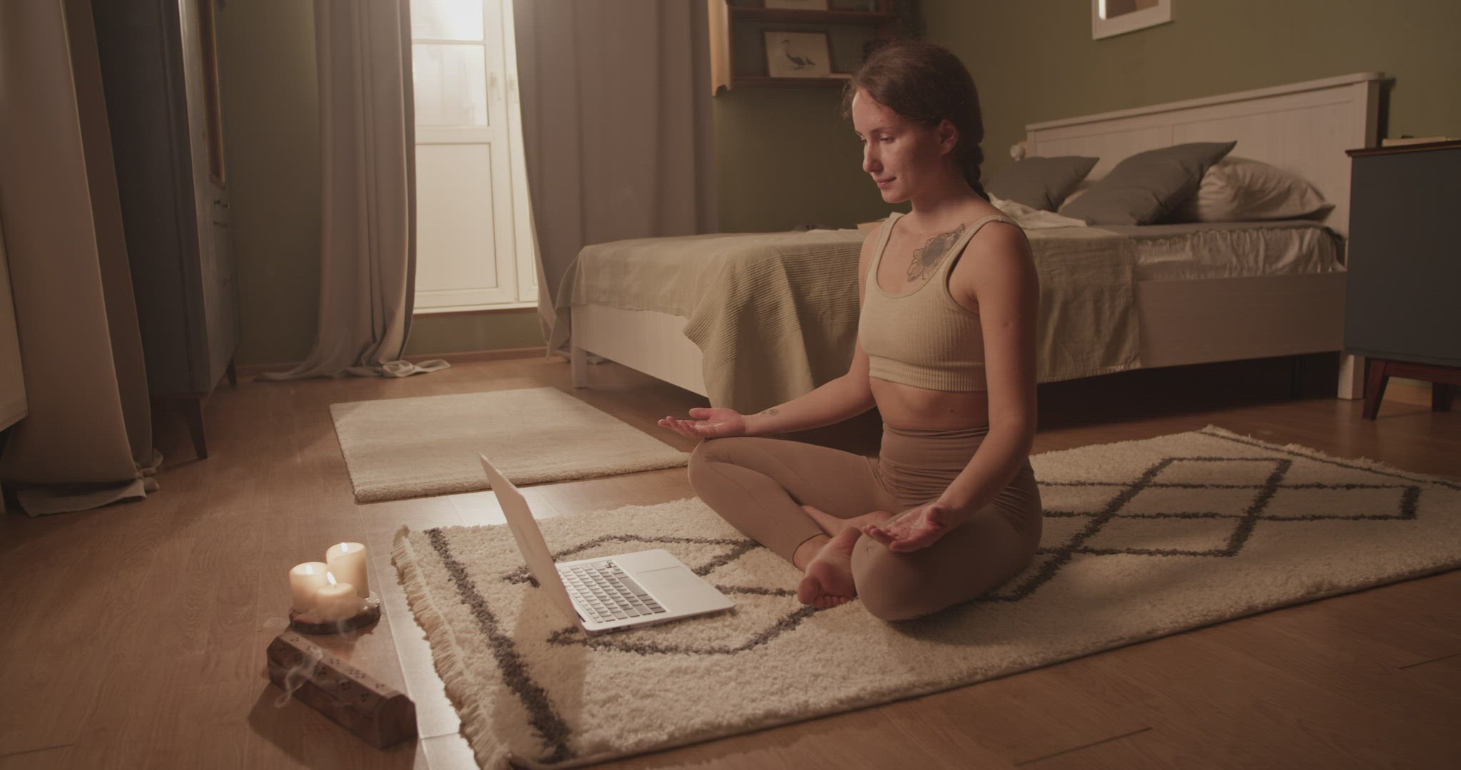 Woman meditating during online lesson