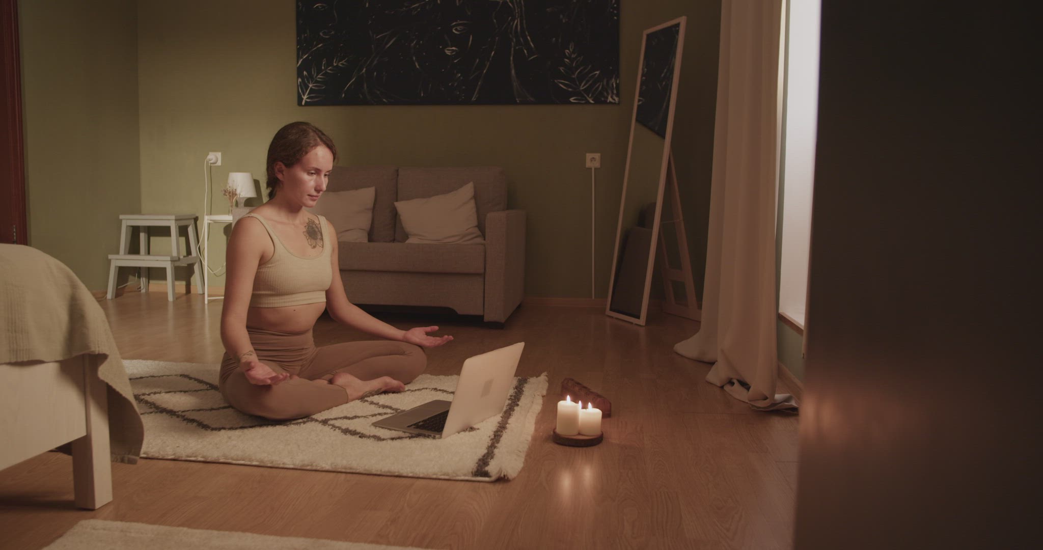 Woman meditating during online lesson