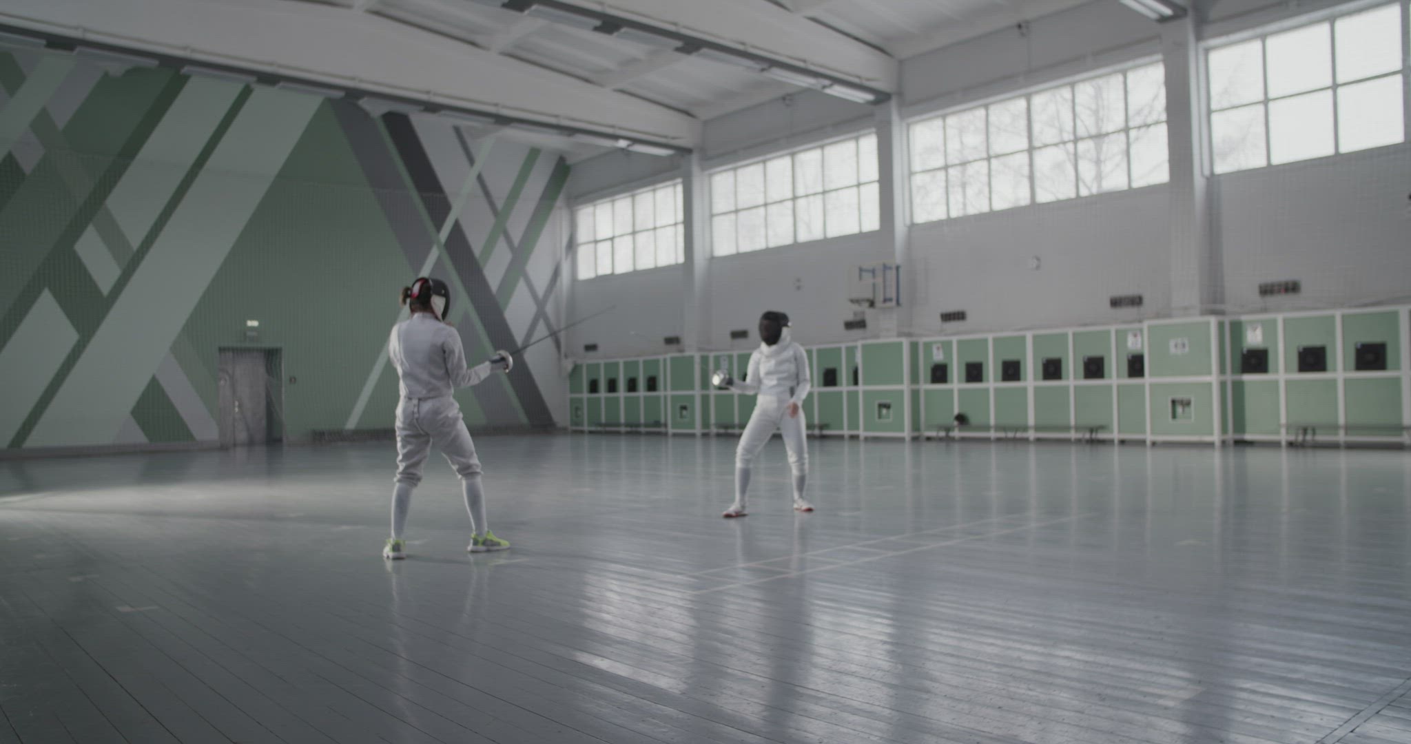 Anonymous women during fencing workout