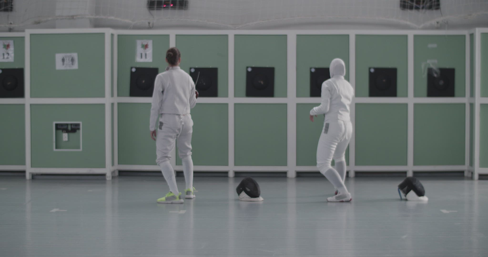 Diverse fencers practicing with targets