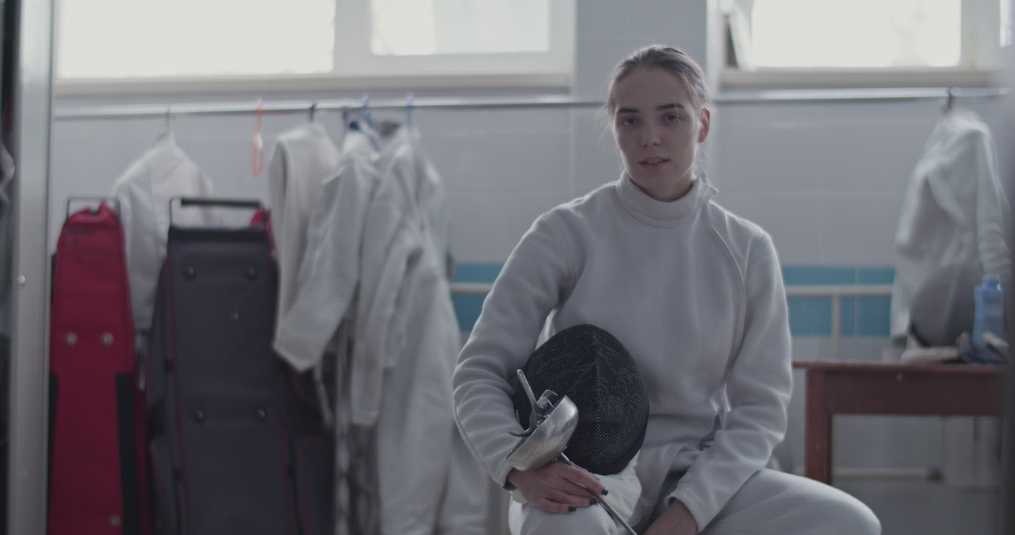 Female fencer in dressing room