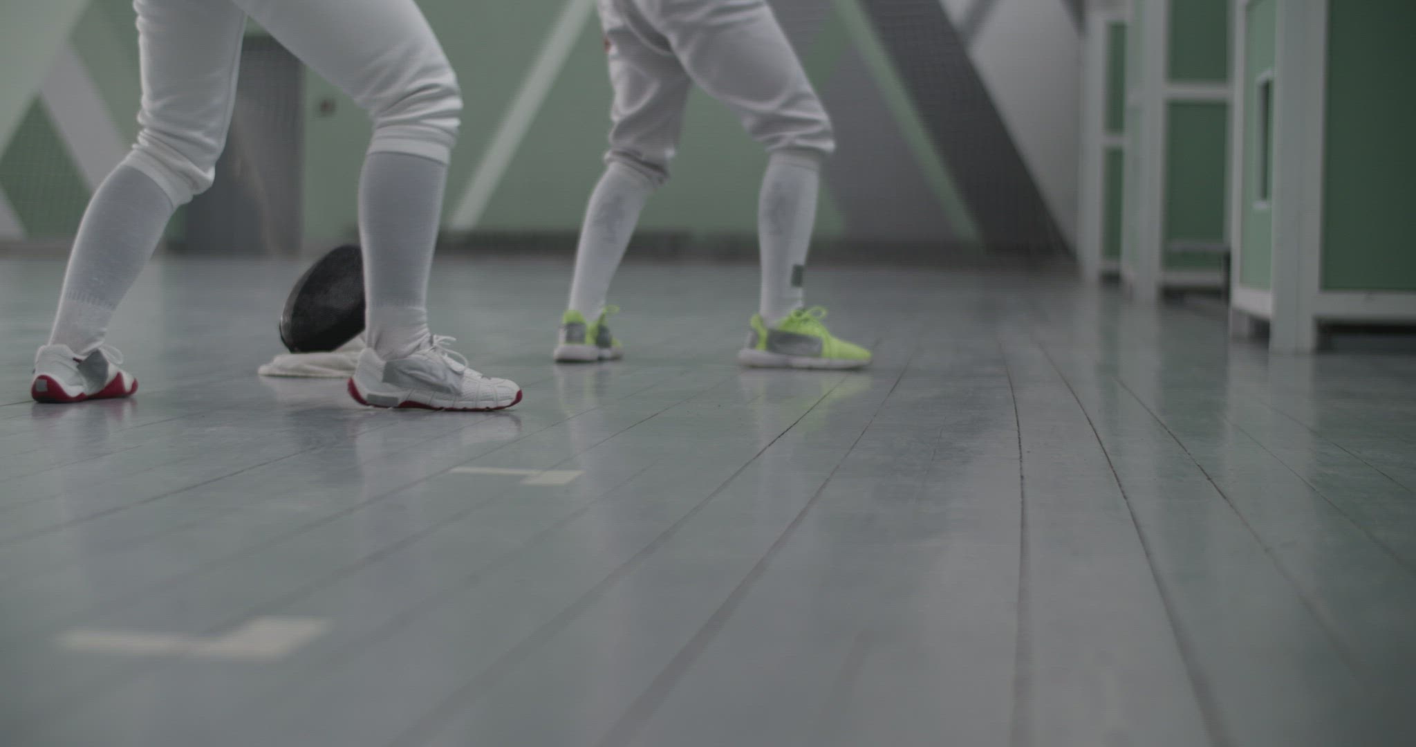 Crop fencers practicing in gym