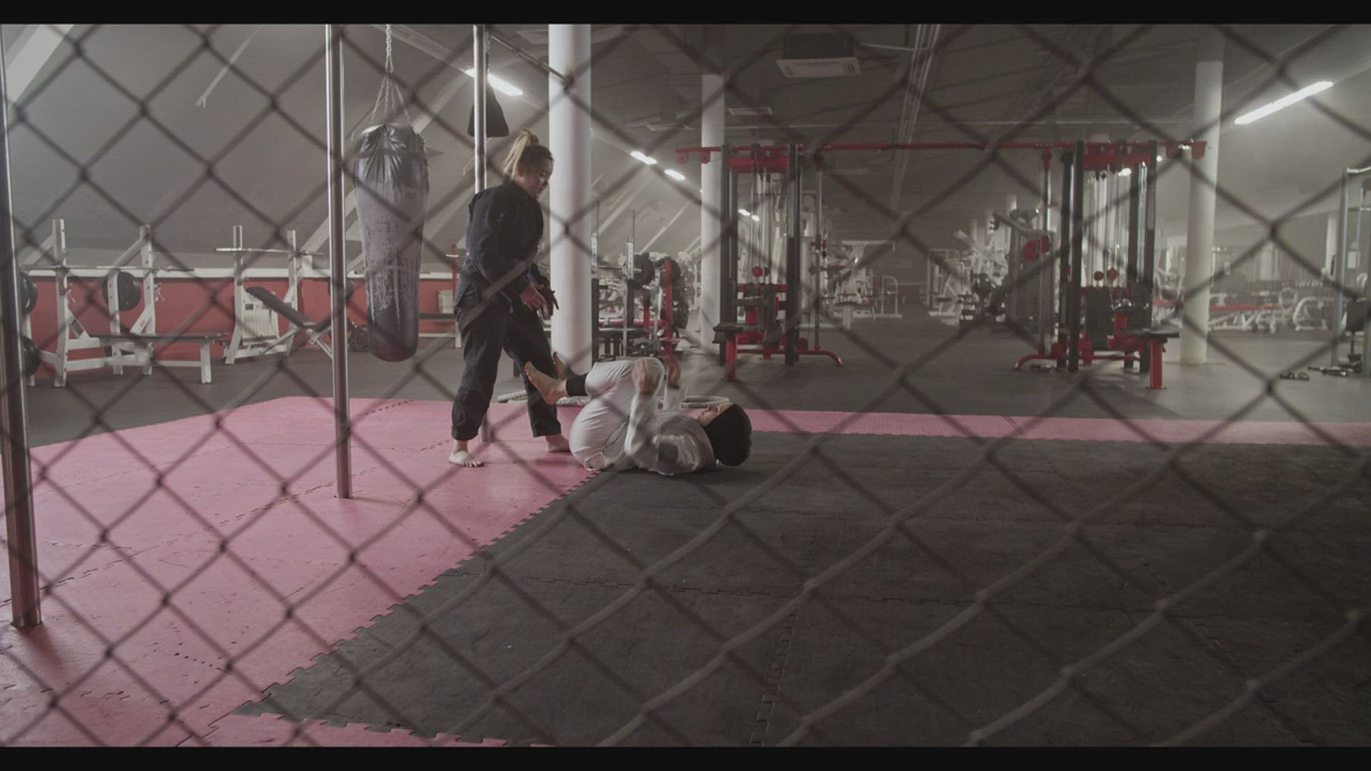 Female fighters practicing BJJ escape technique