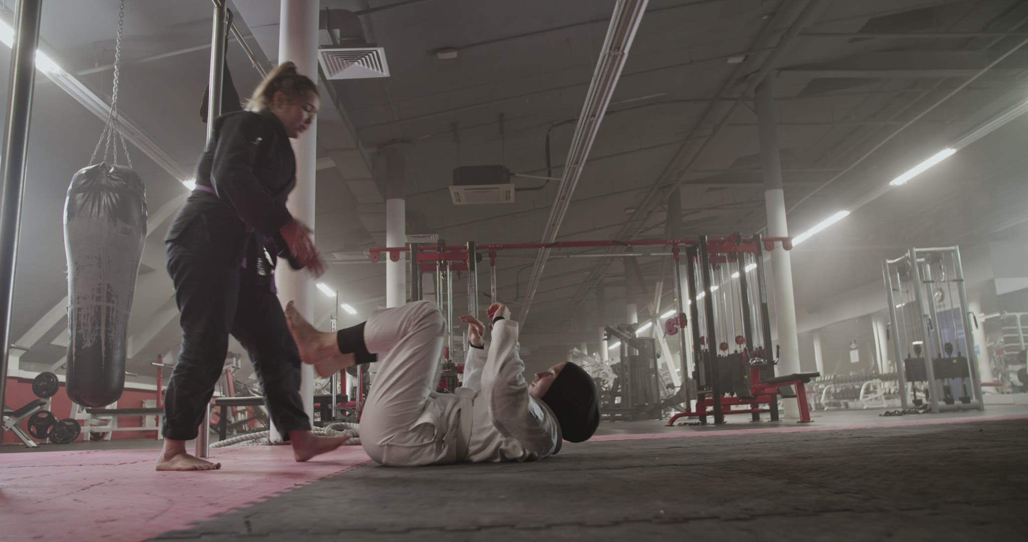 Female wrestlers practicing in gym