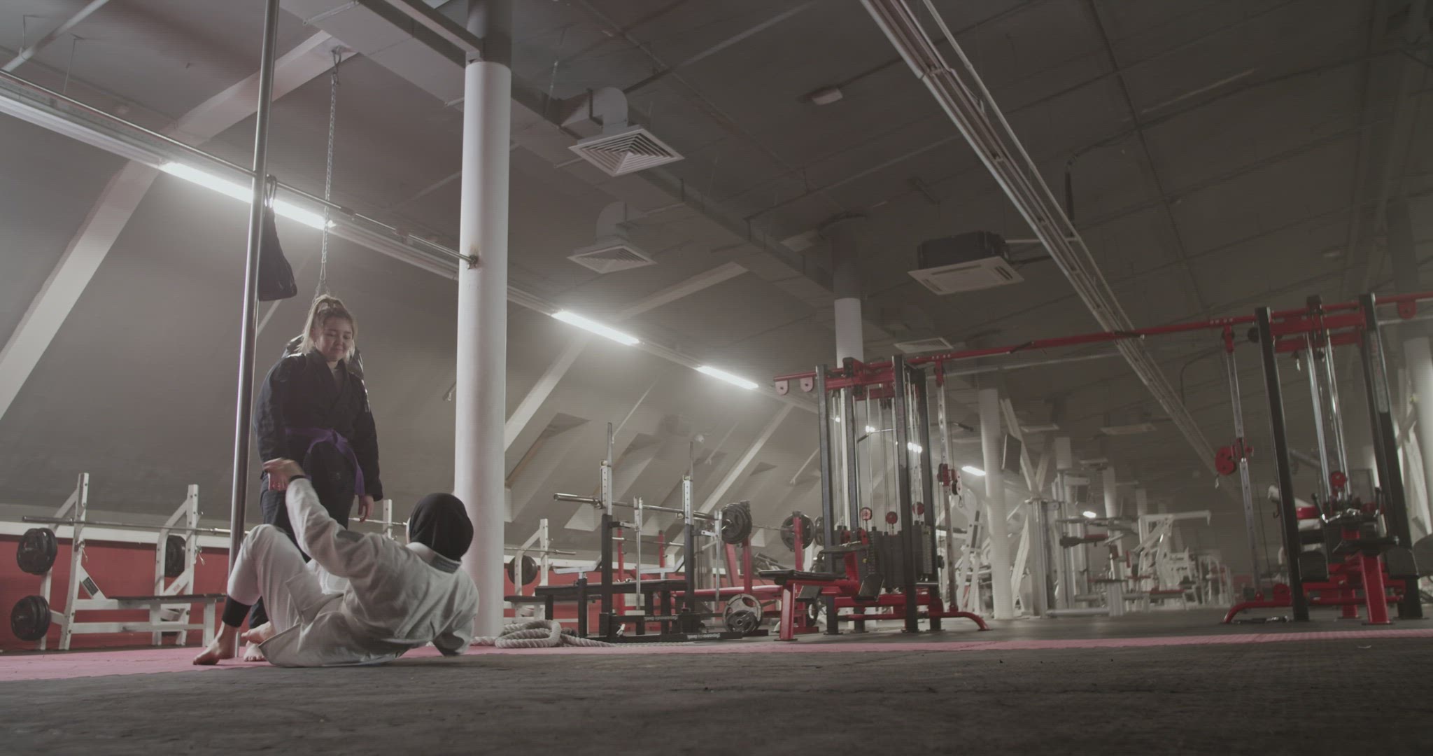 Female wrestlers practicing in gym