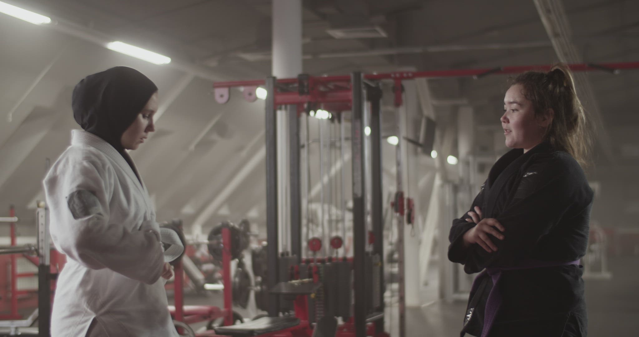 Female trainer supporting Muslim fighter
