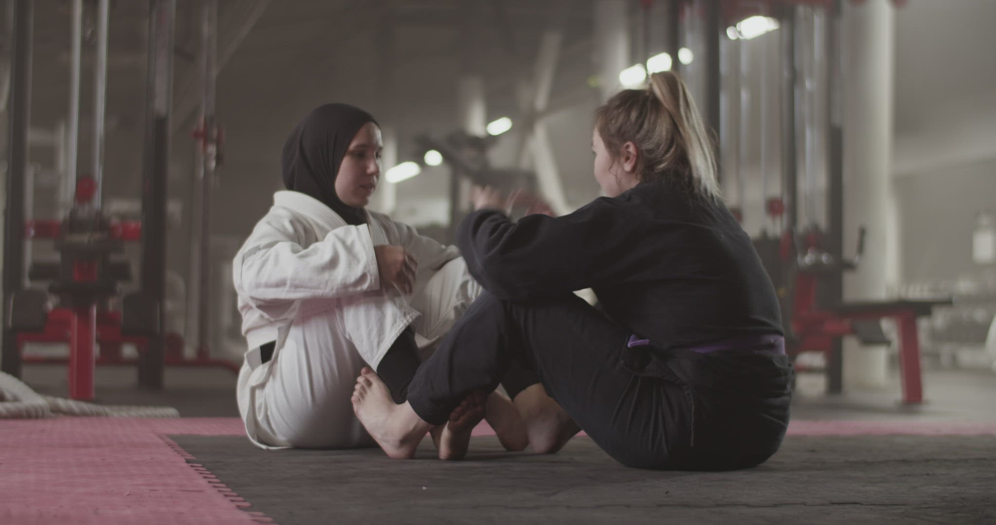 Diverse female wrestlers doing sit ups