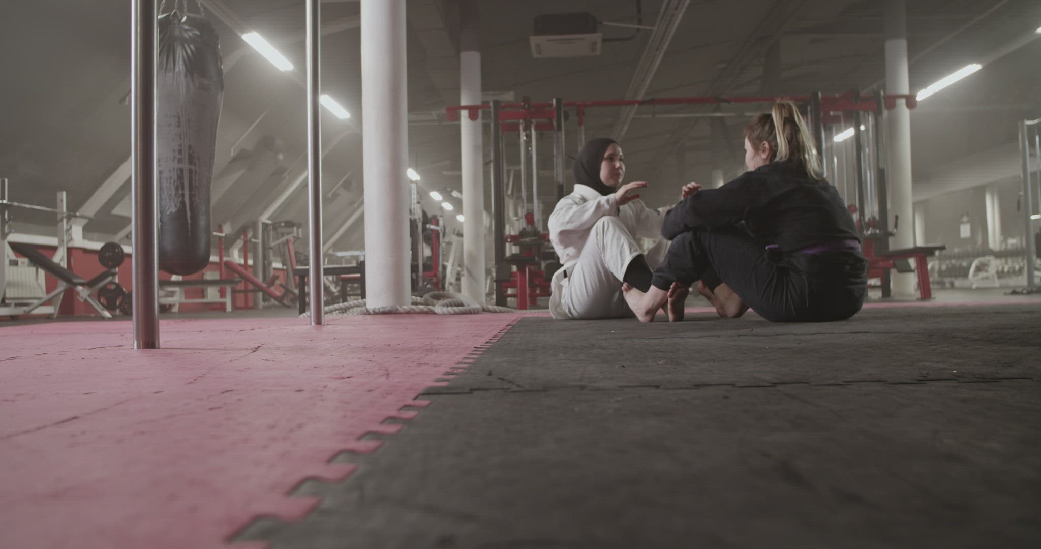 Diverse female wrestlers doing sit ups