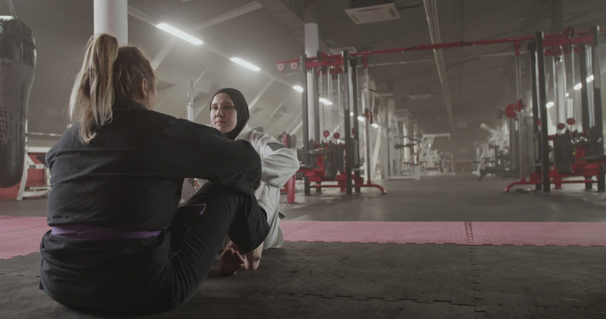 Diverse female wrestlers doing sit ups