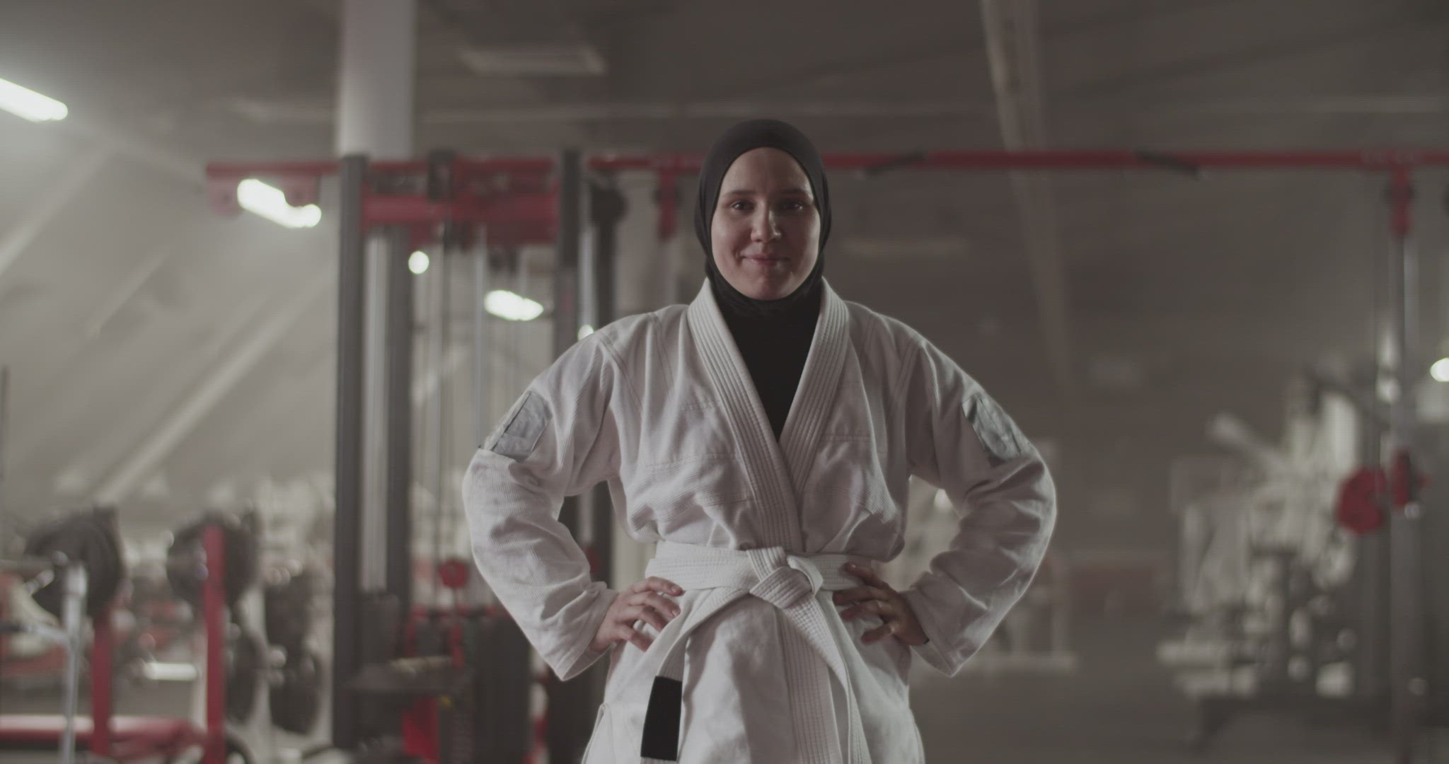 Positive Muslim fighter in gym
