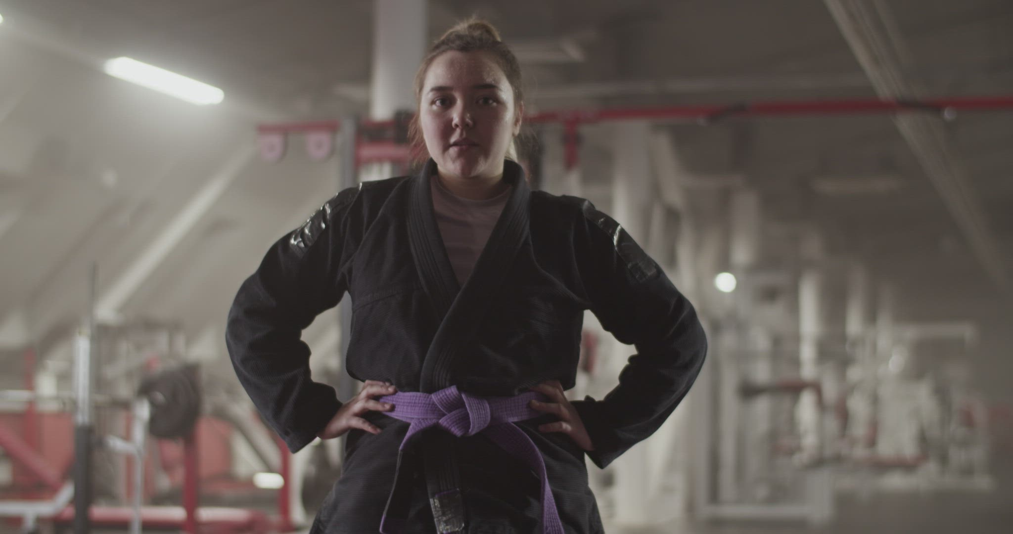Female fighter with hands on waist