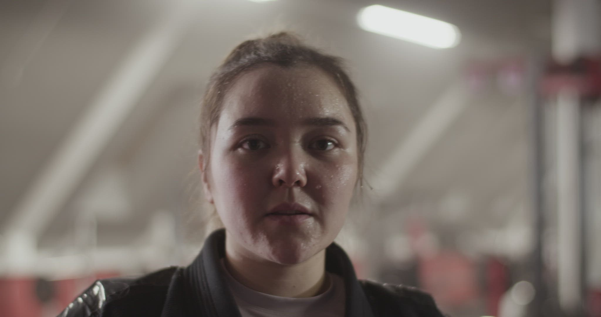 Female fighter with hands on waist