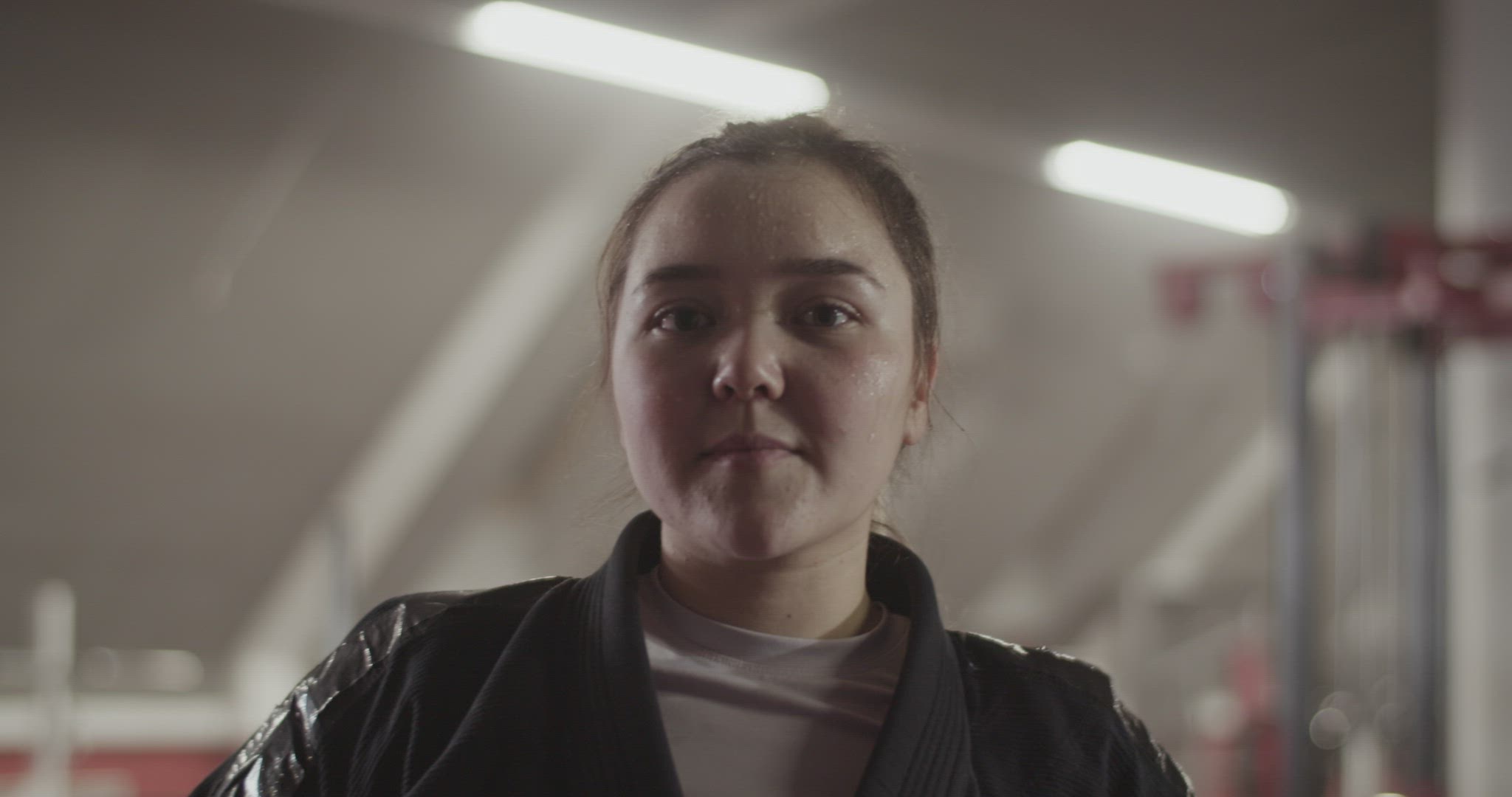 Female fighter with hands on waist