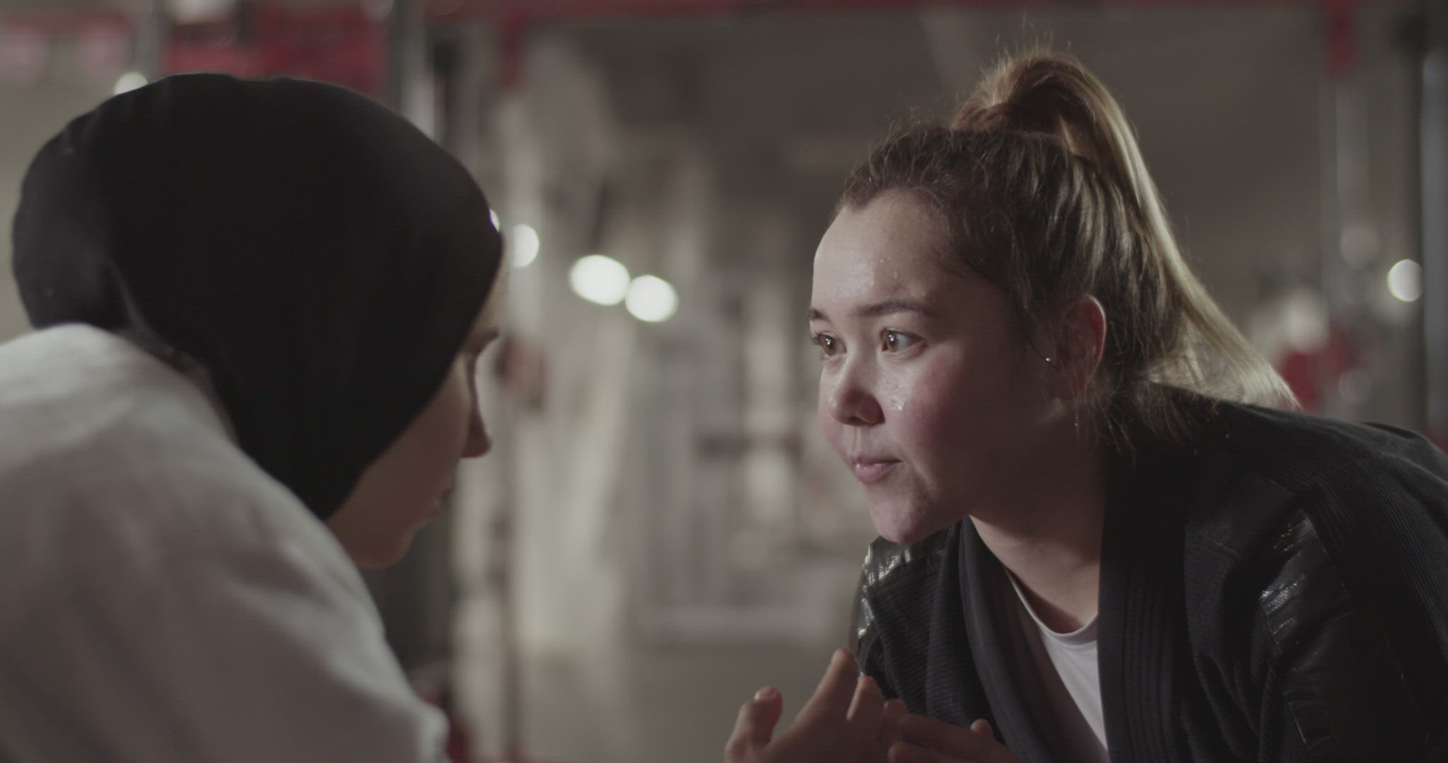 Female wrestlers looking at each other during fight
