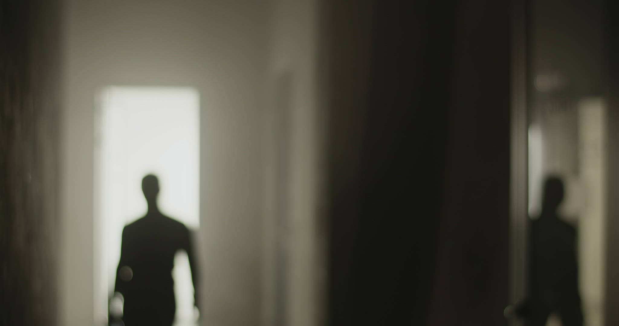 Young sportswoman walking in hallway before training