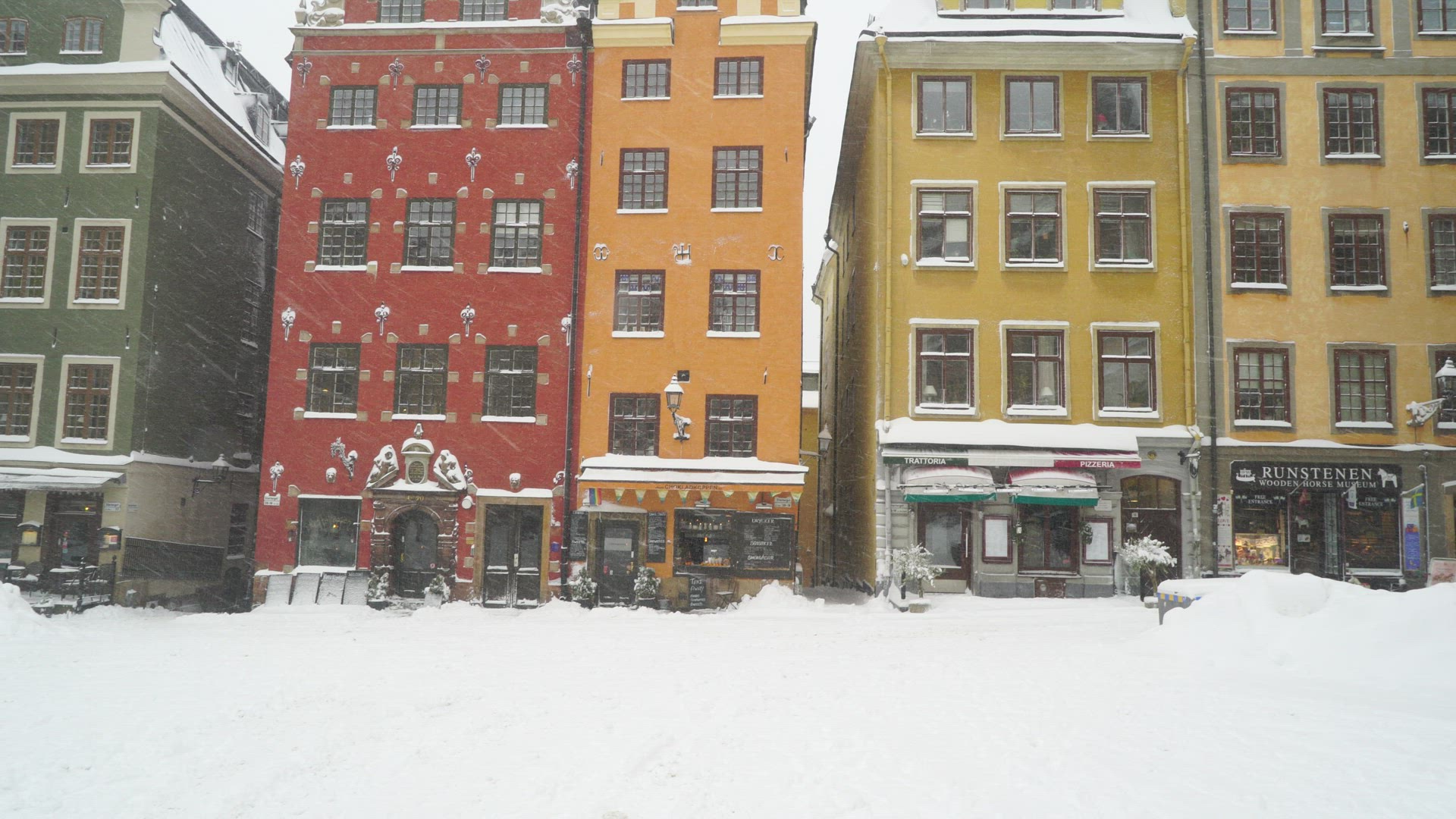 heavy snowfall in old town stockholm - snowcovered square at stortorget 