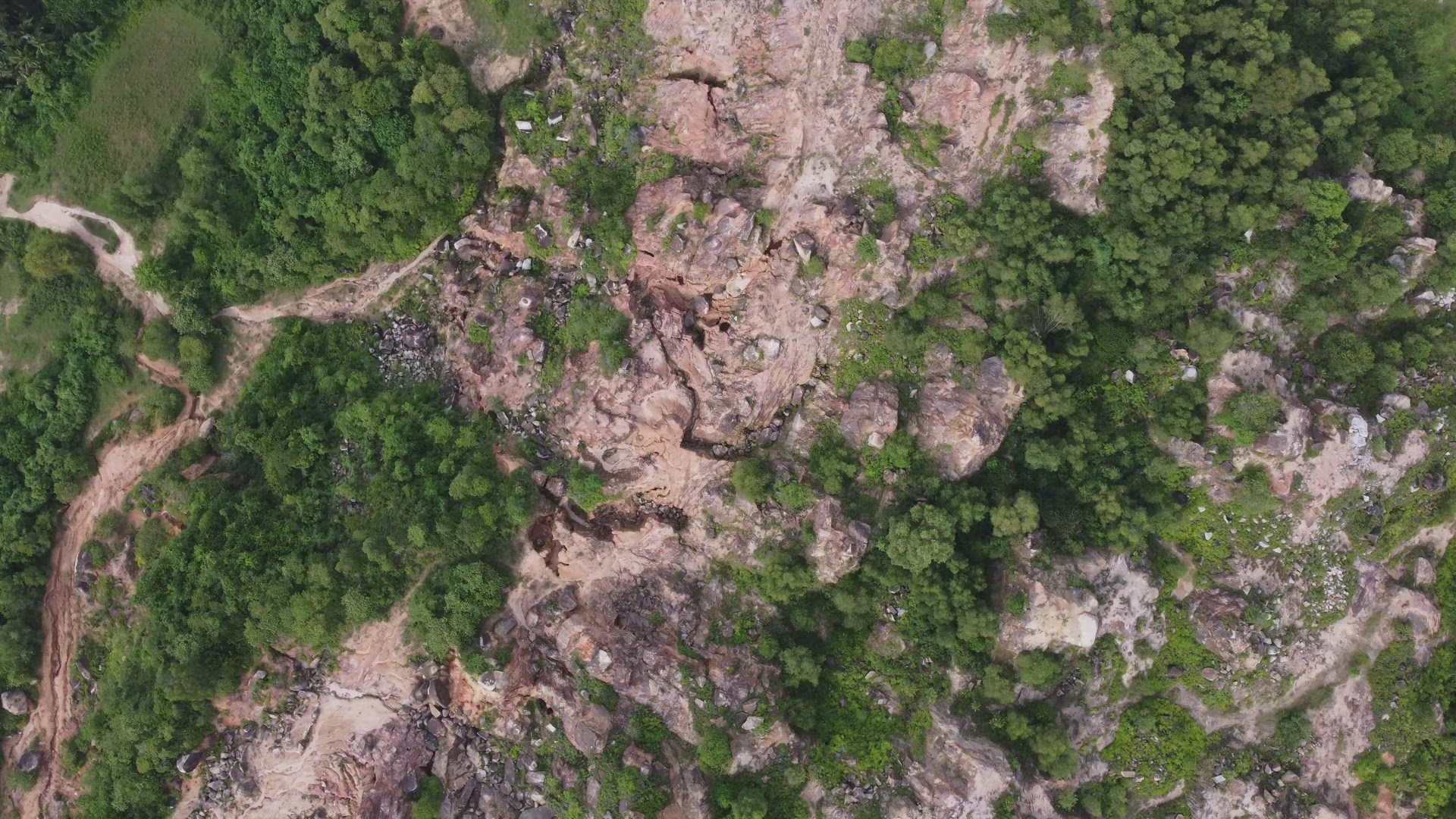Aerial rotate and look down red clay soil