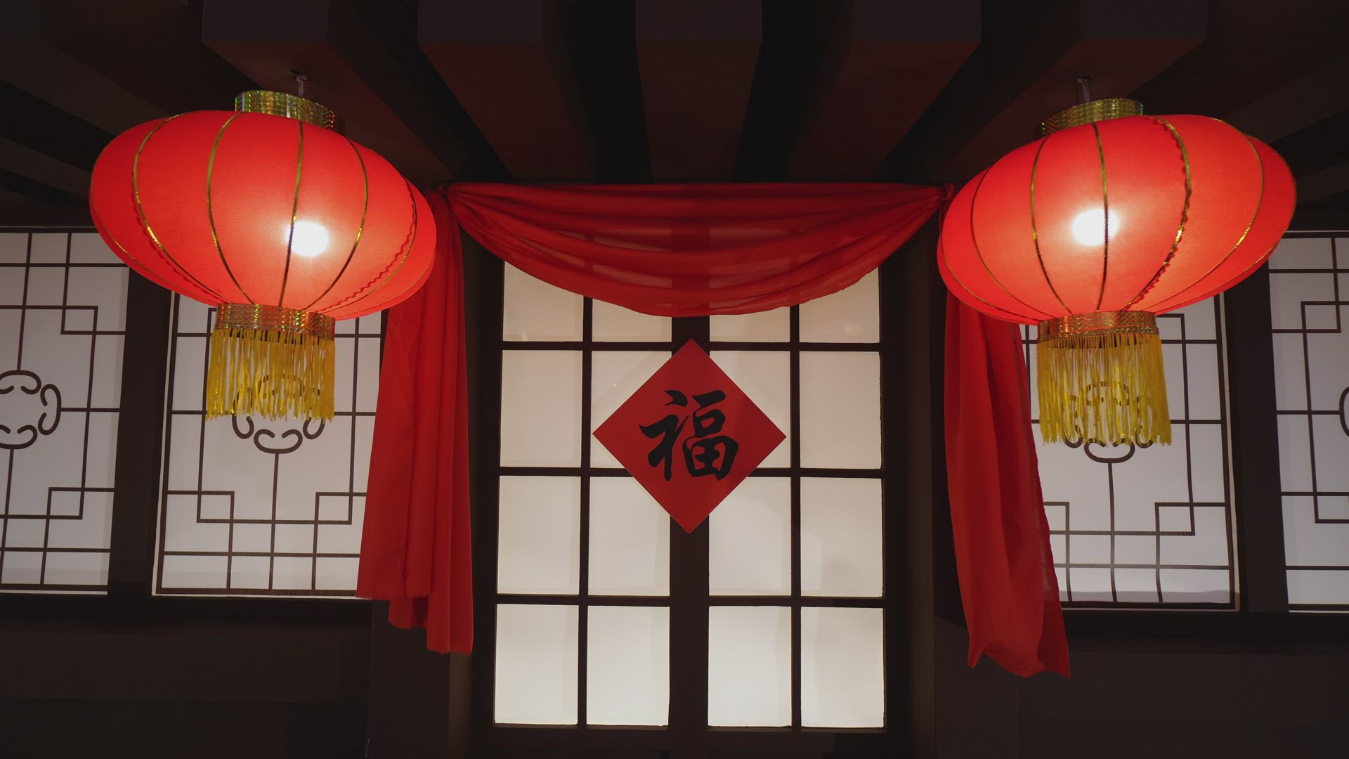 Slowly move toward door with red spring festival couplet paper