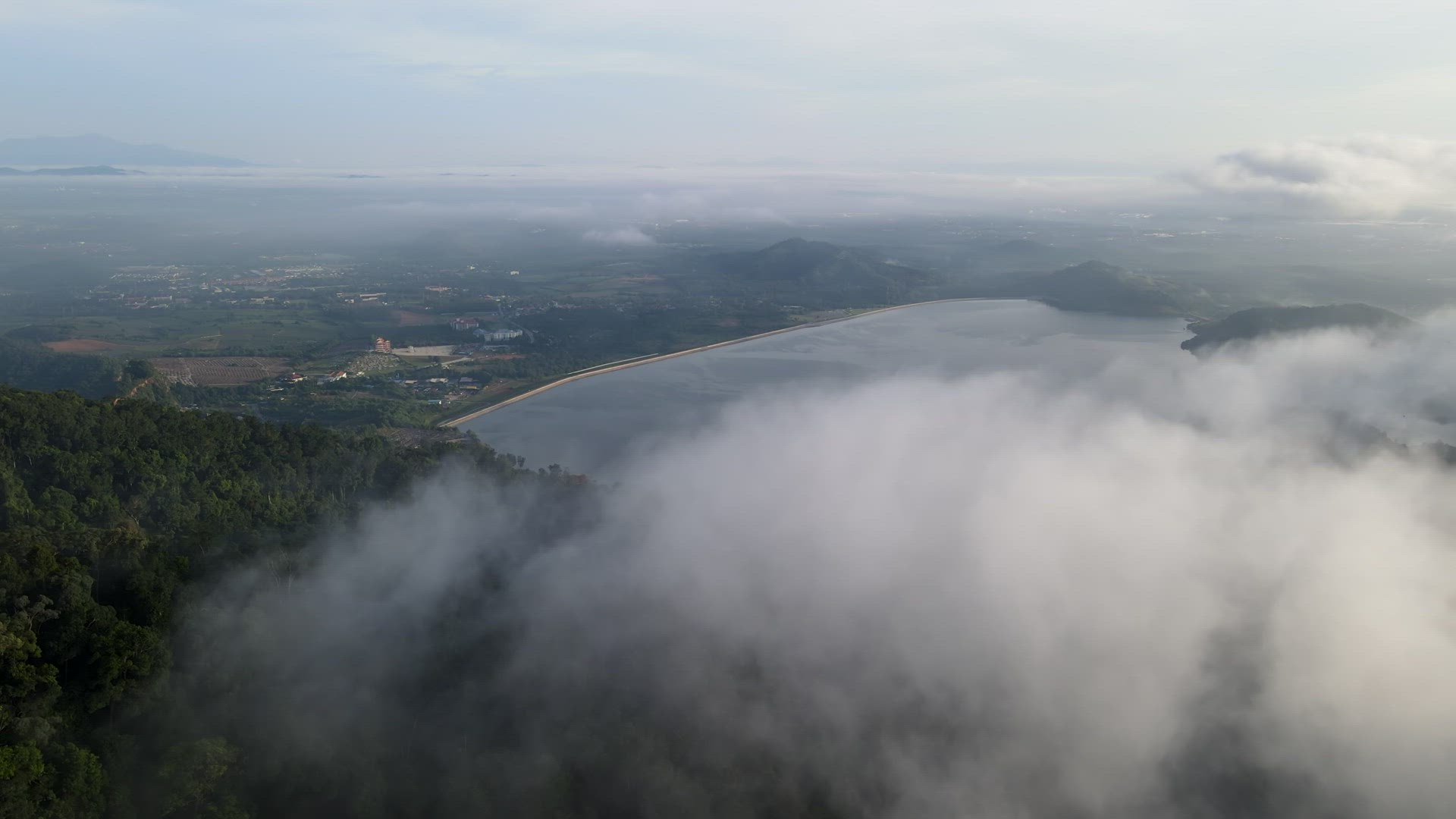 Aerial view Mengkuang Dam over low cloud