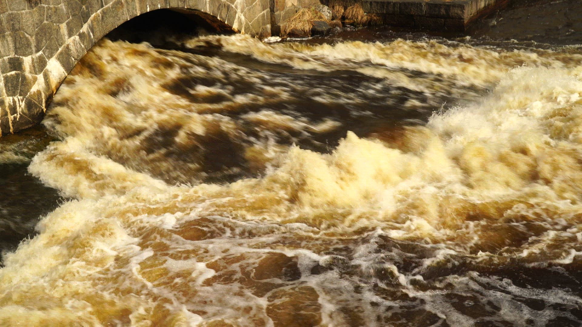 streaming water - water streaming under bridge