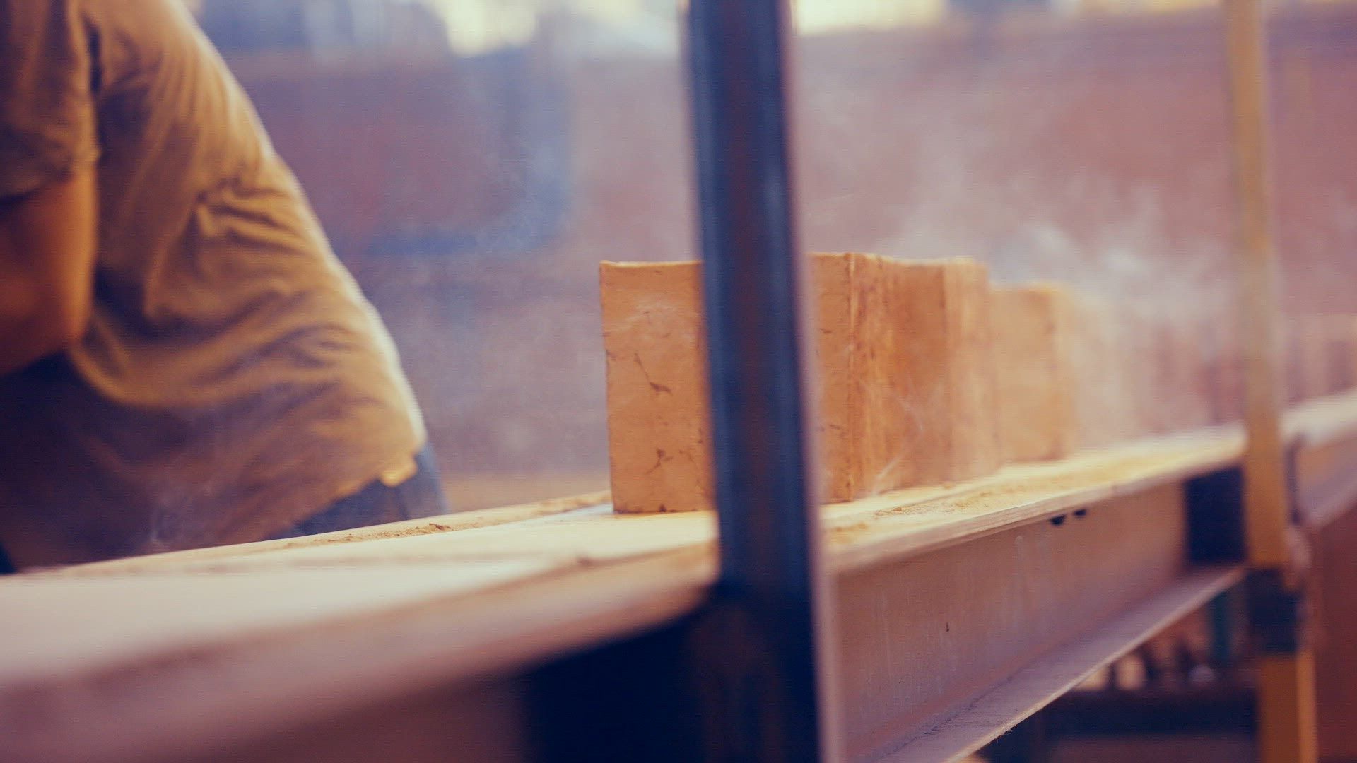 Vintage bricks being put on conveyor belt