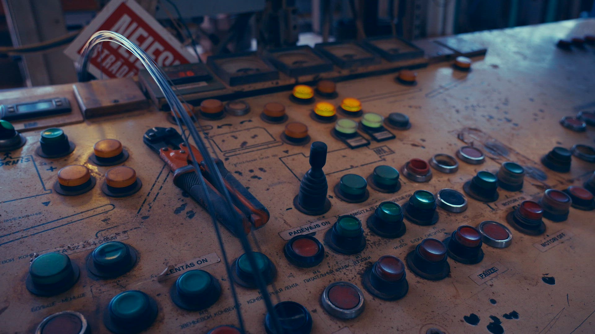 Worker pushing buttons on factory console