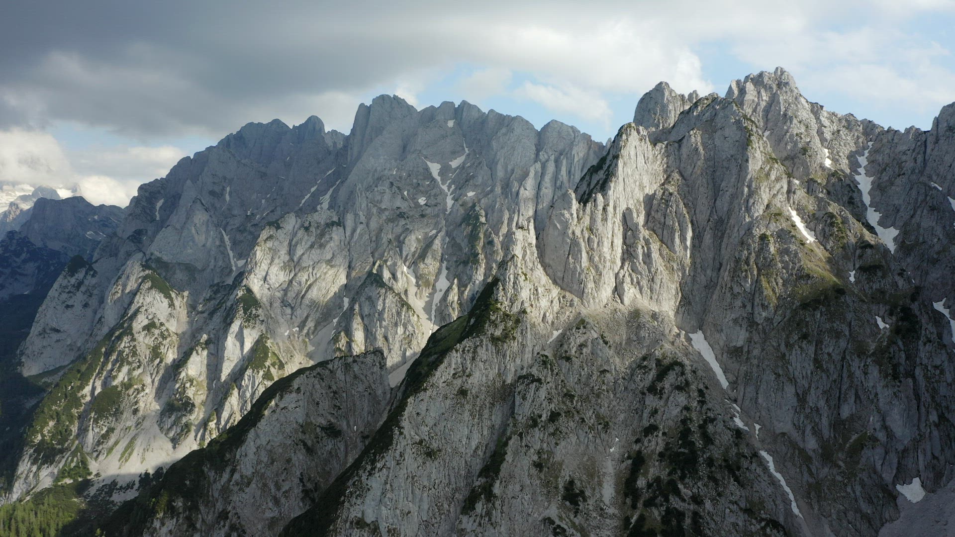 Aerial fly around Dachstein top summit mountain top located near Hinterer Gosausee lake Upper Austri