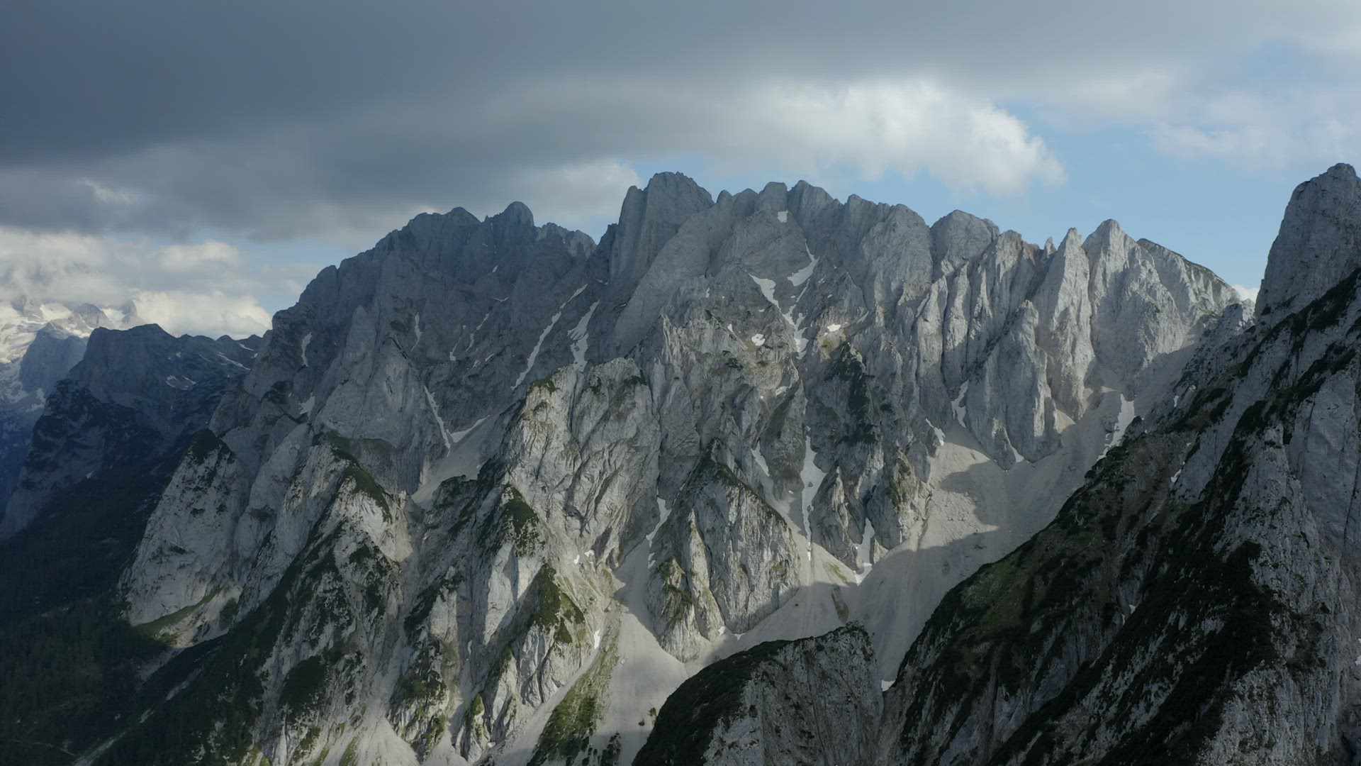 Aerial fly towards Dachstein top summit mountain top located near Hinterer Gosausee lake Upper Austr