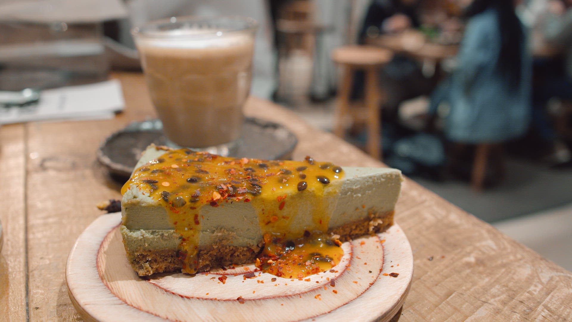 Cheesecake with passion fruit sauce for dessert in cafe
