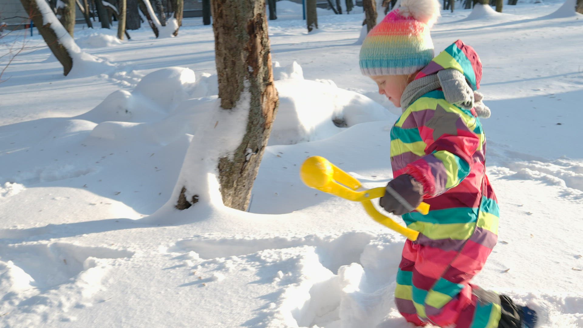 Happy kid enjoying the walk in deep snow