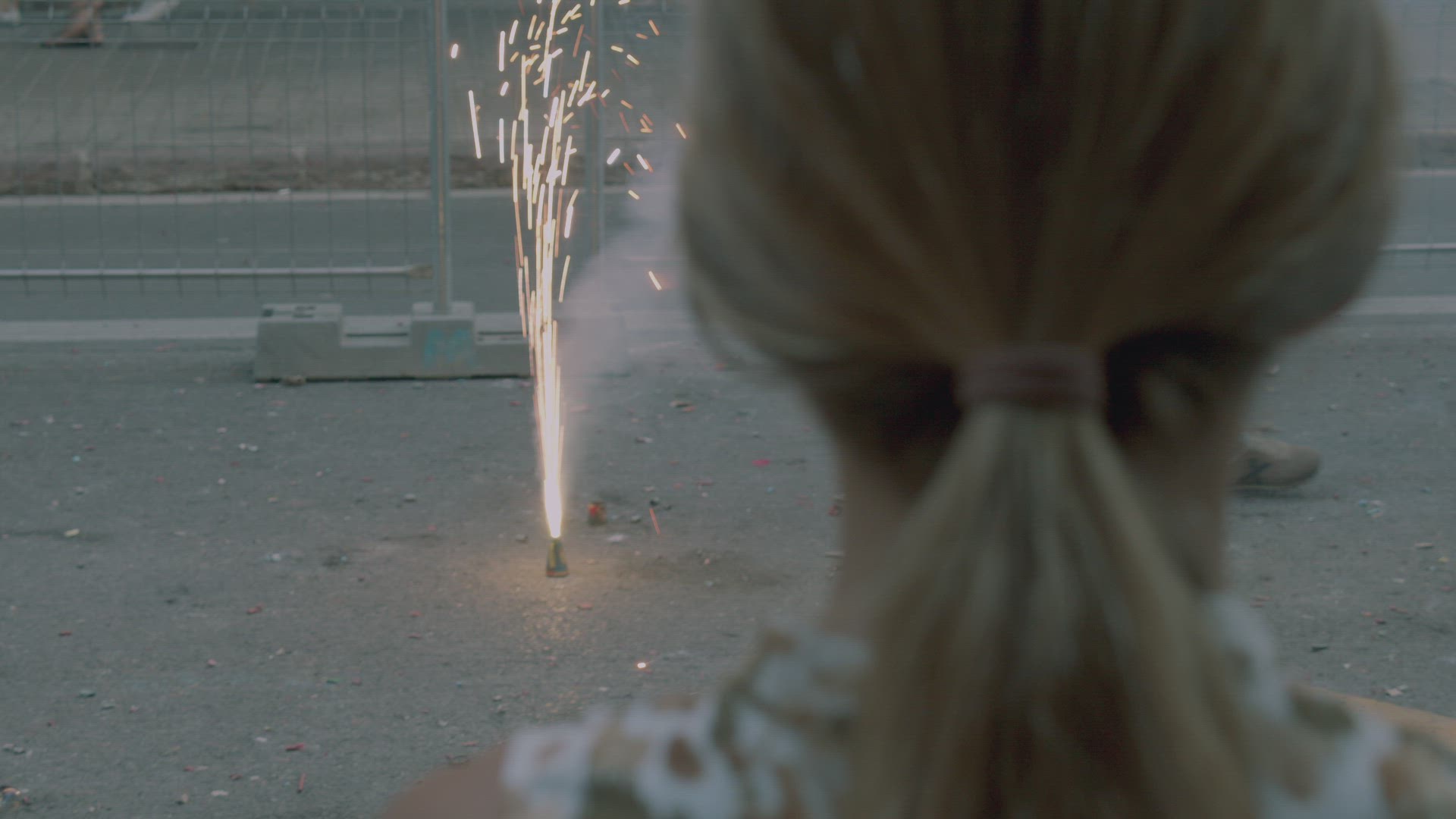 Girl is attracted with a small firework