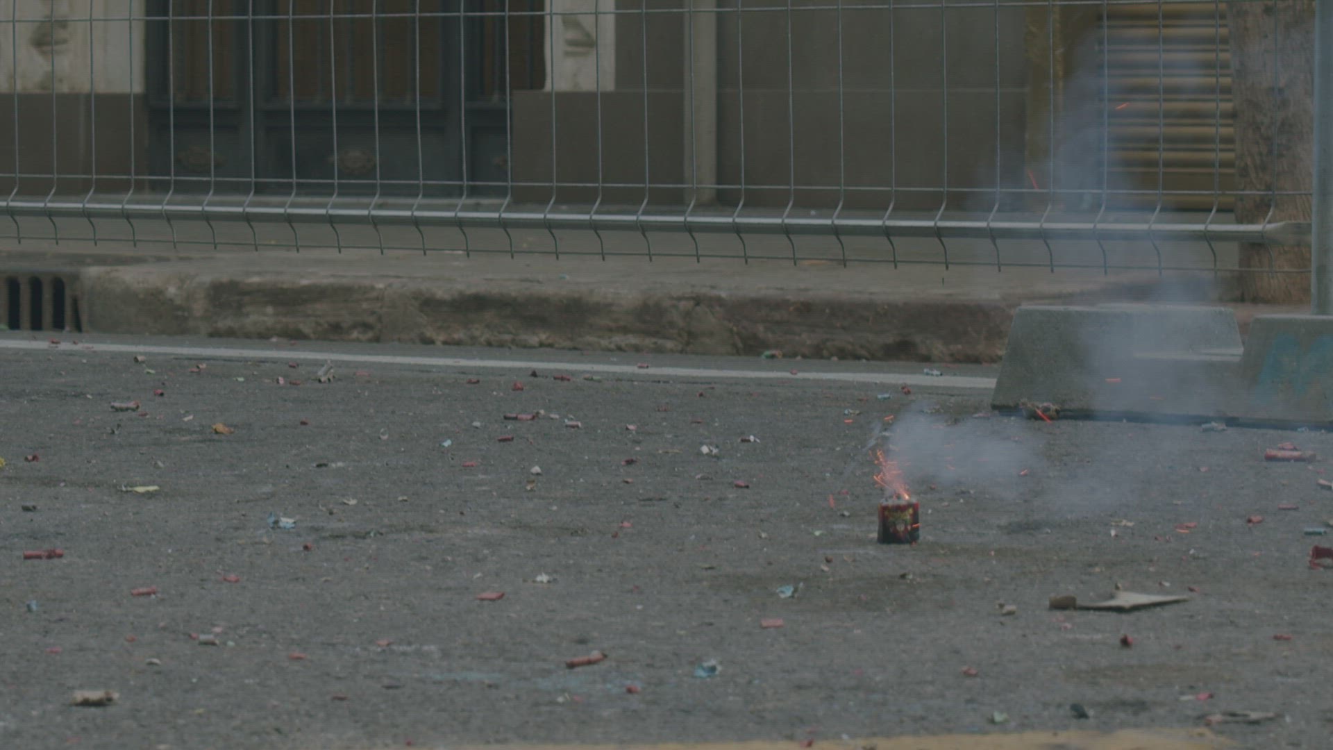 Firecracker bursting in the street. Las Fallas celebration, Spain