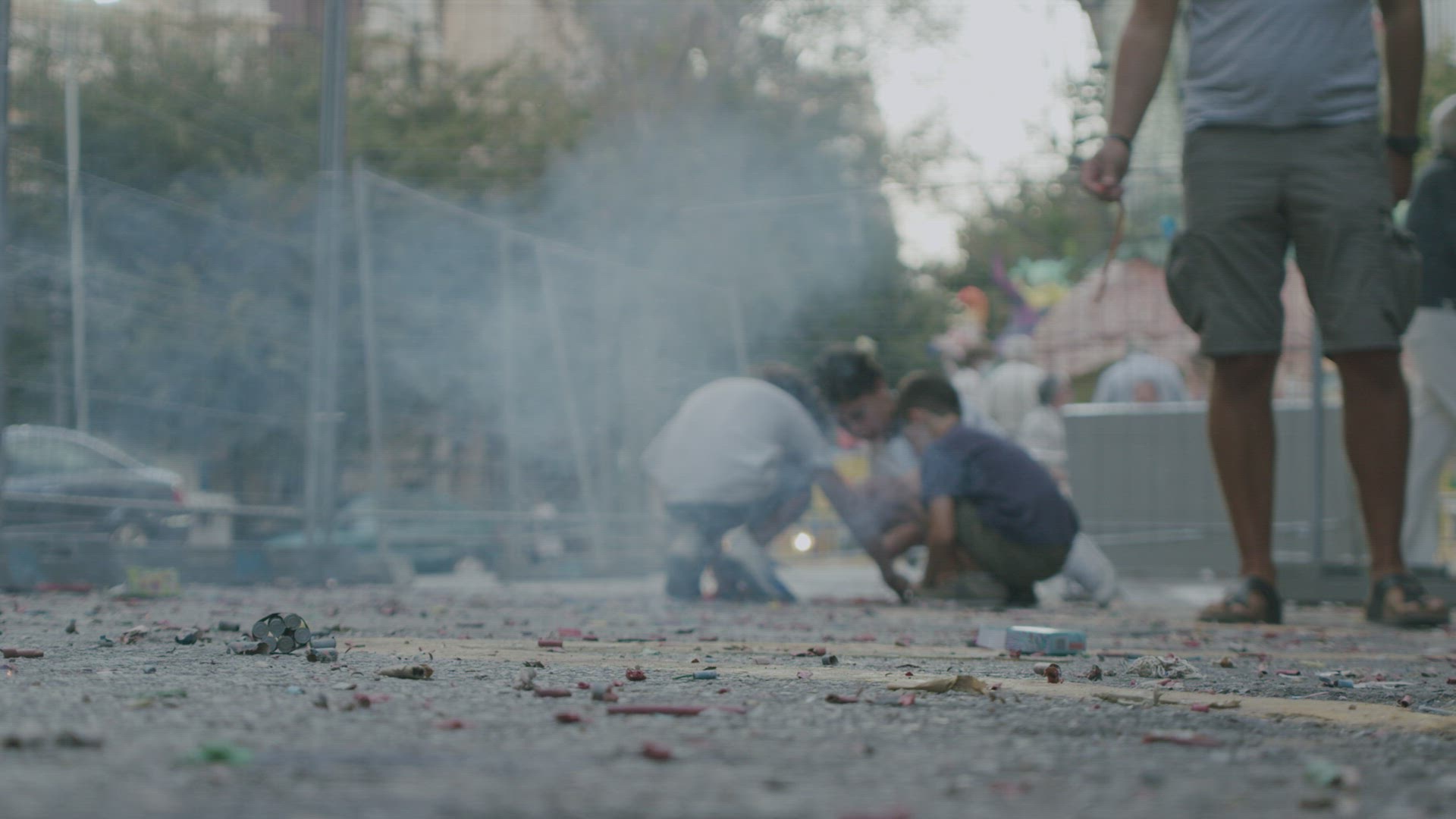 Children and exploding firecracker on Las Fallas, Spain