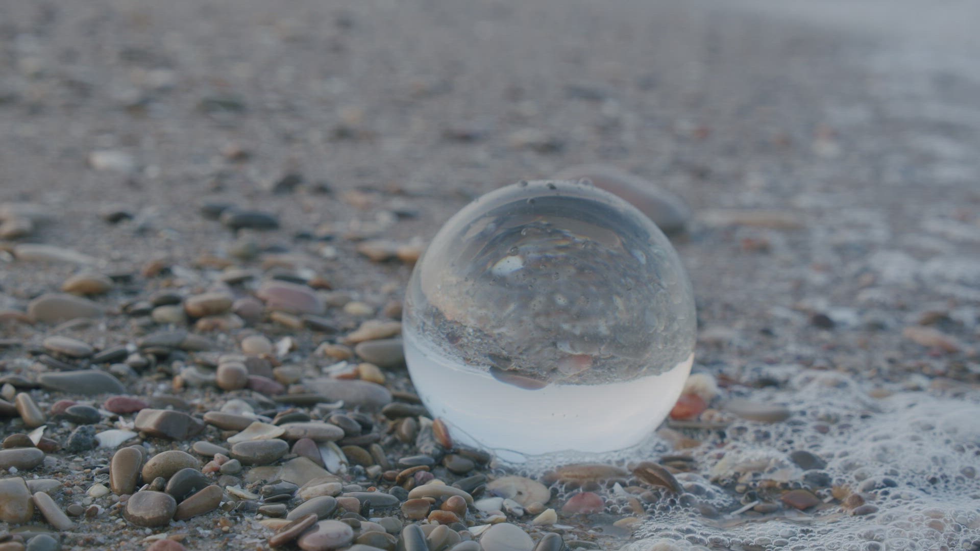 Glass ball on the seashore