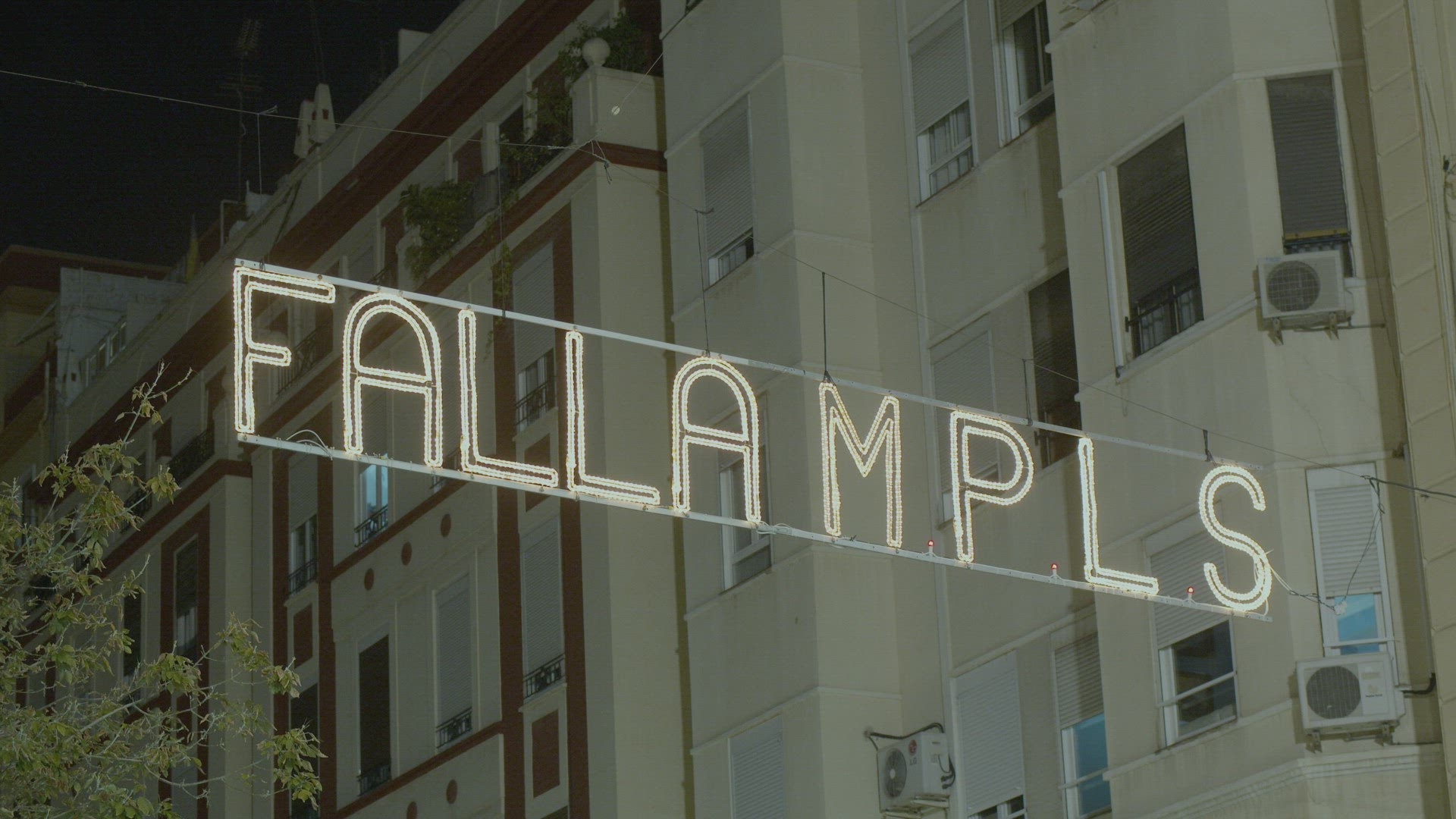 Night view of illuminated banner in celebration of Las Fallas, Valencia