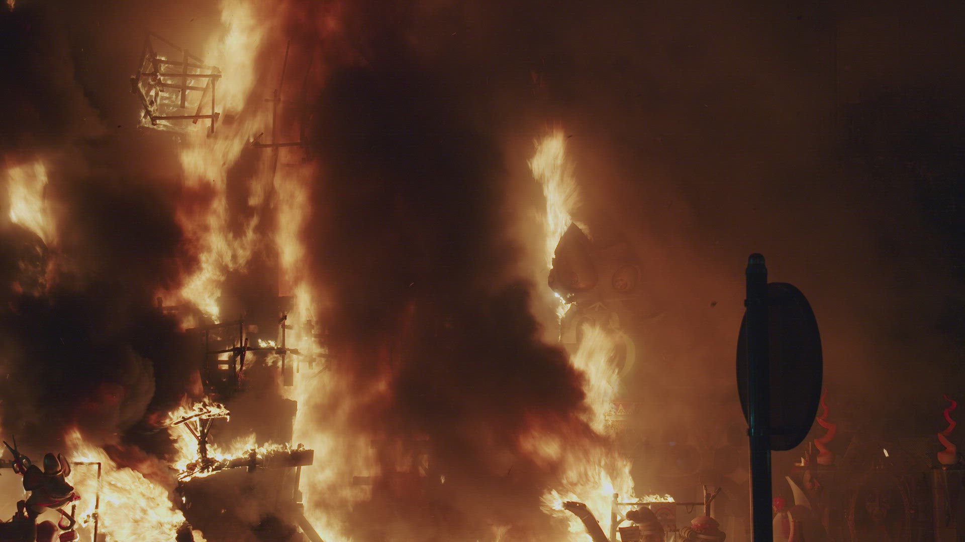 Burning ruins of street installation on Las Fallas festival in Spain