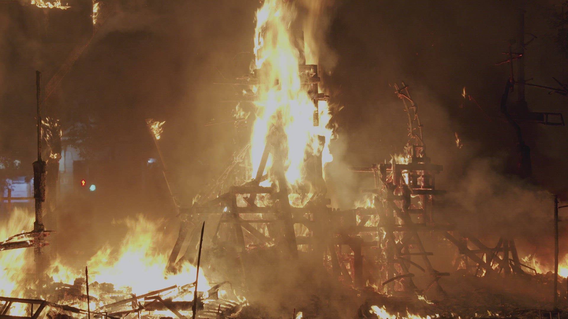A fragment of a wooden structure is burning brightly