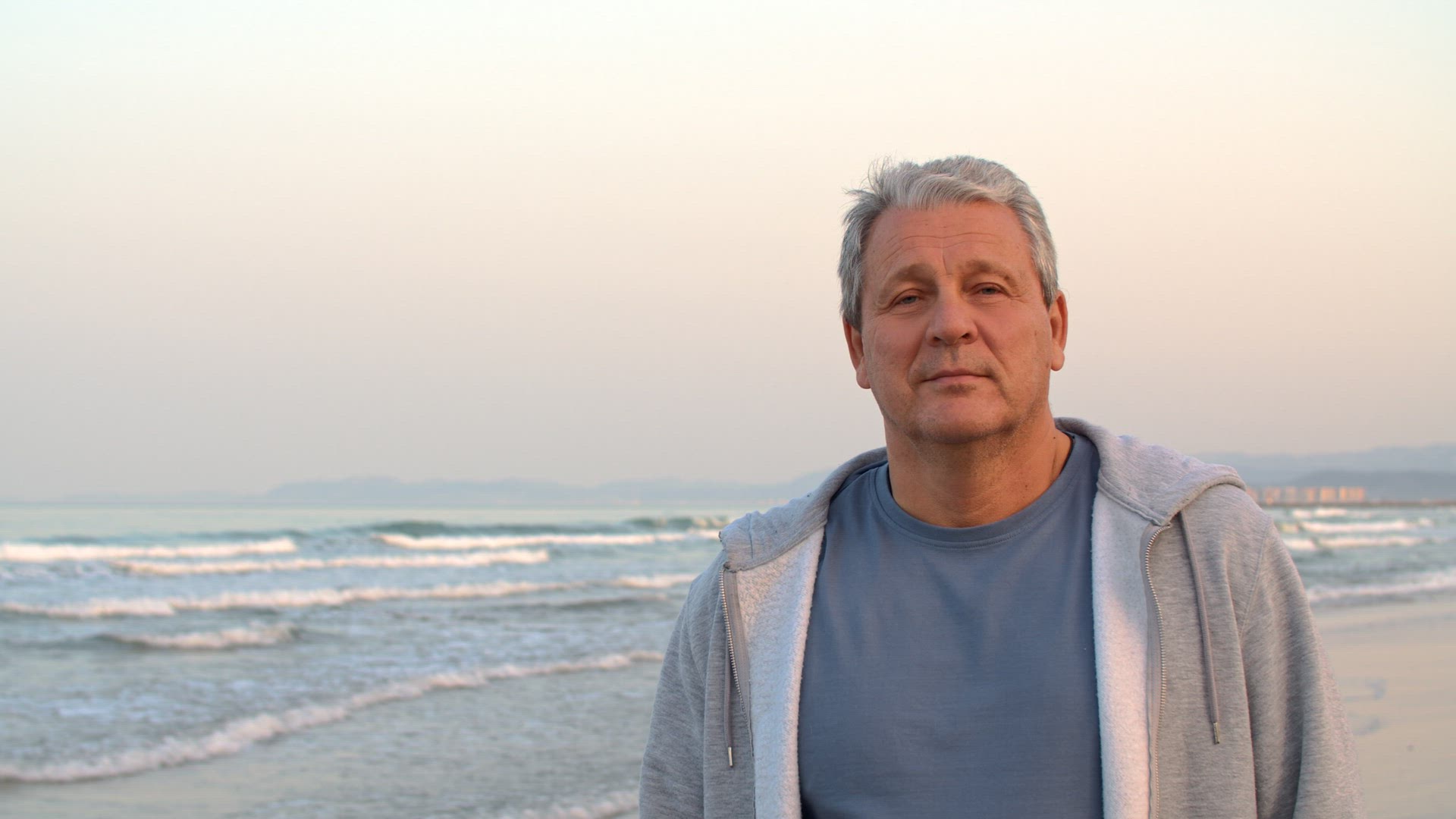 Man on the background of the sea