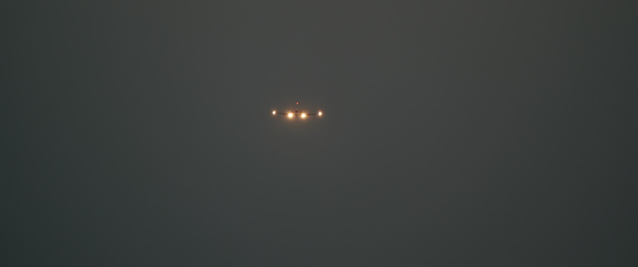 The plane lands at night
