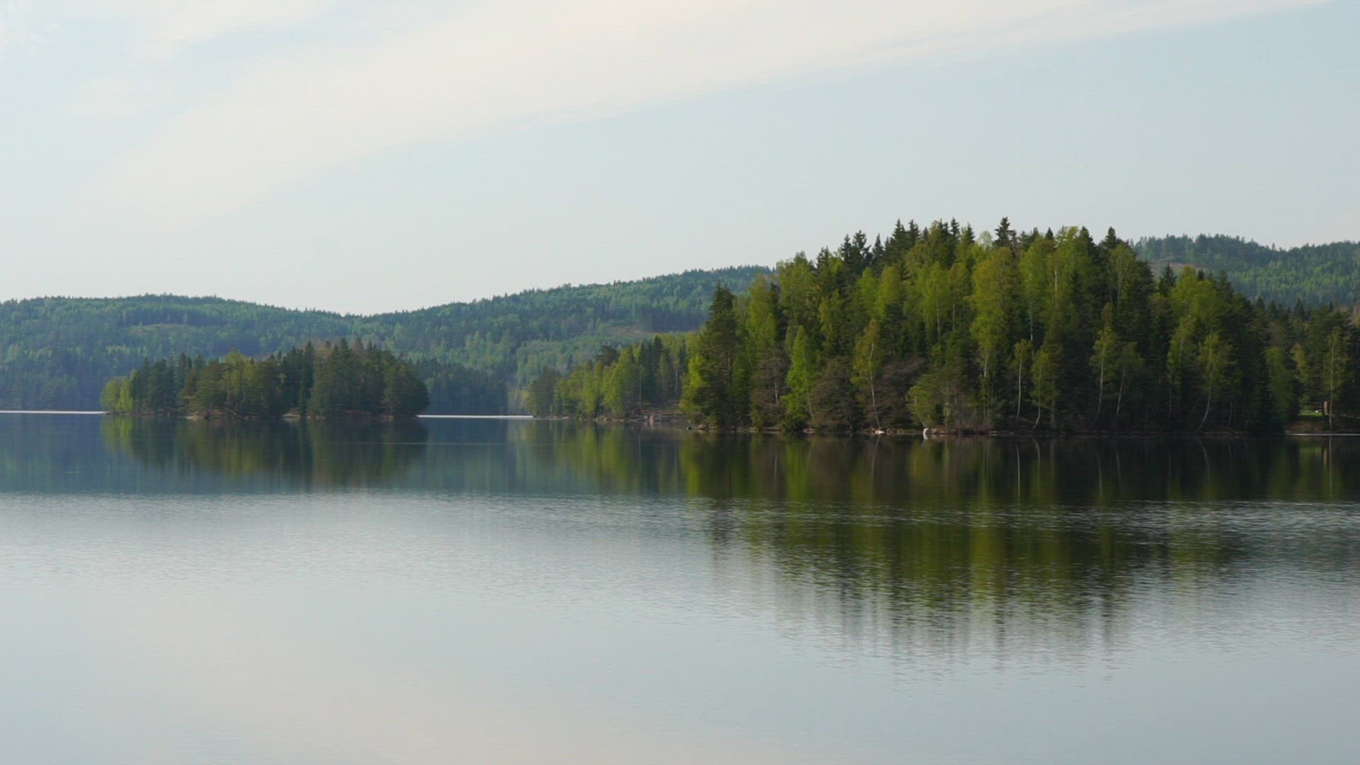 mirror lake in värmland - early morning shot - mirror image - reflections on lakes surface