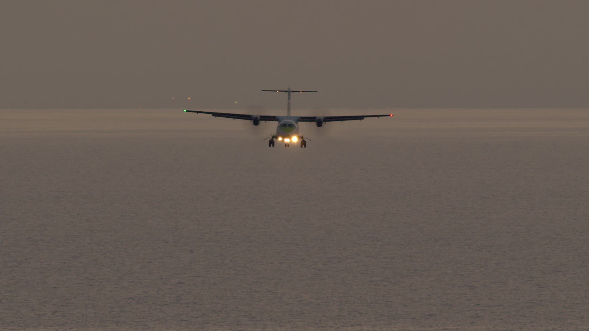 The plane is landing at the airport