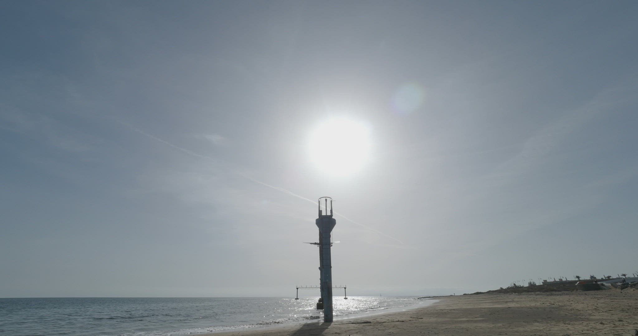 The plane flies against the background of the sea
