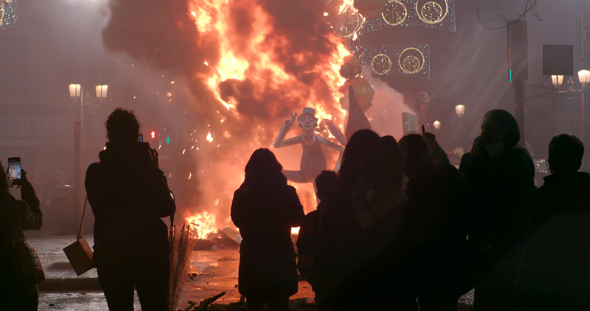 Fallas festival and people near the burning ninot, Spain