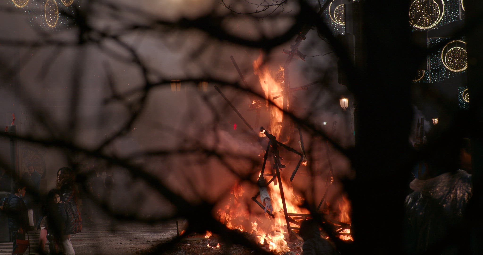Night bonfires in city streets during Fallas festival in Spain